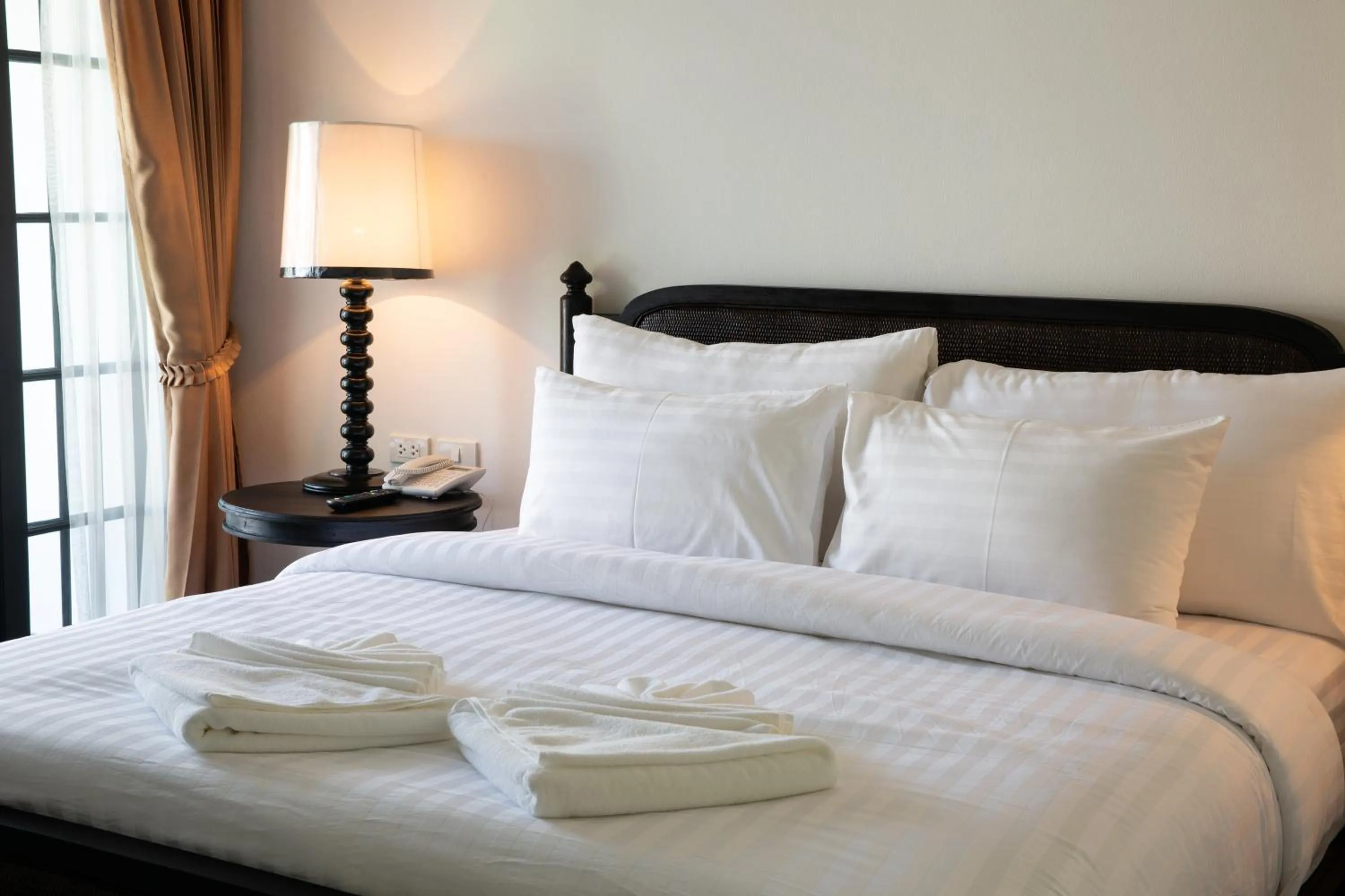 Bed in MORA Boutique Hotel