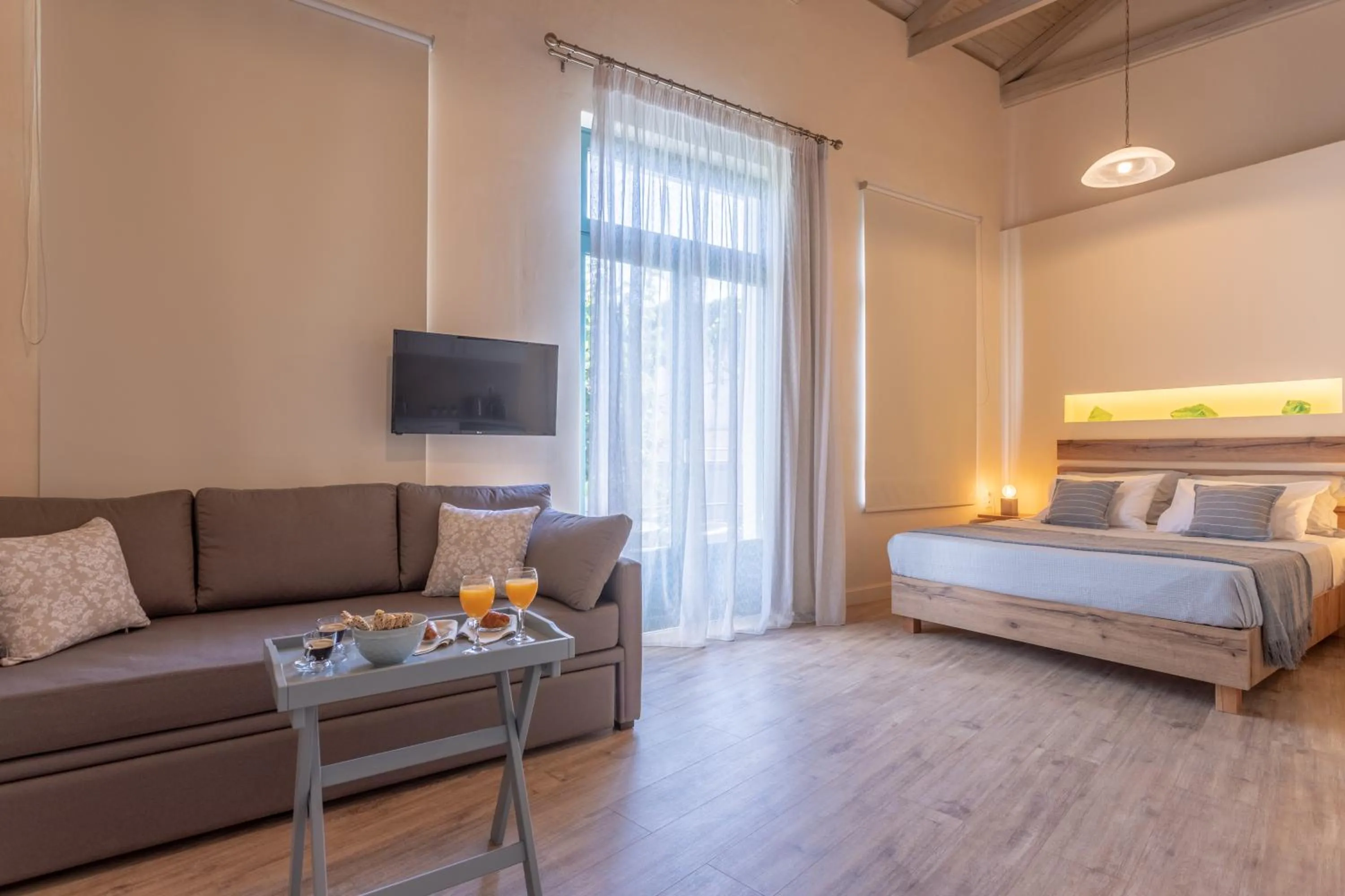 Living room, Bed in Ancient Agora Apartments
