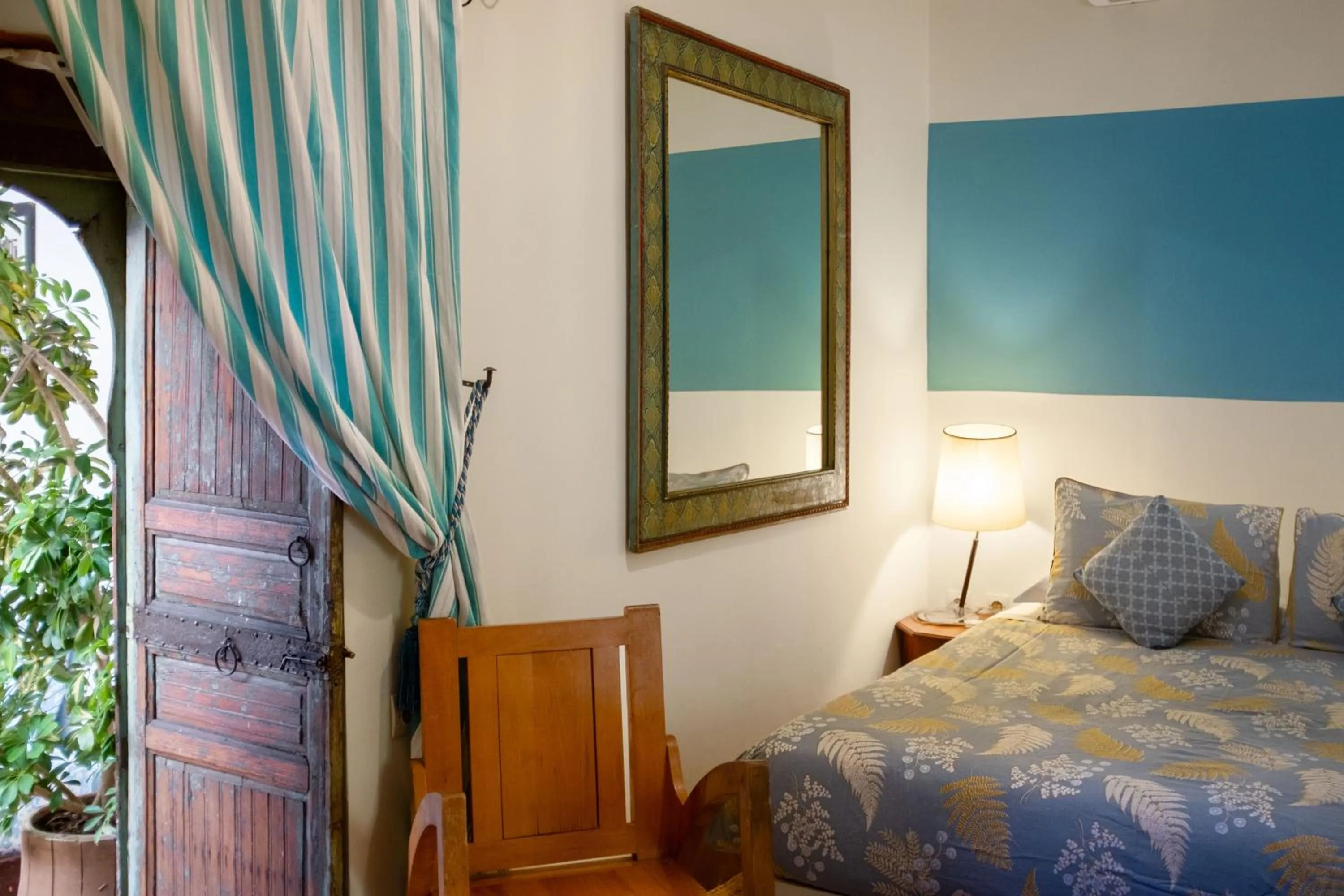 Bed in Riad Le Coq Berbère