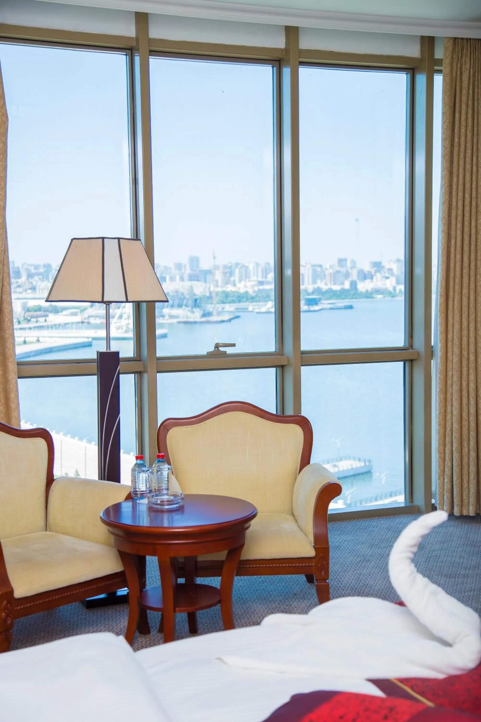Seating area, Bed in Golden Coast Hotel