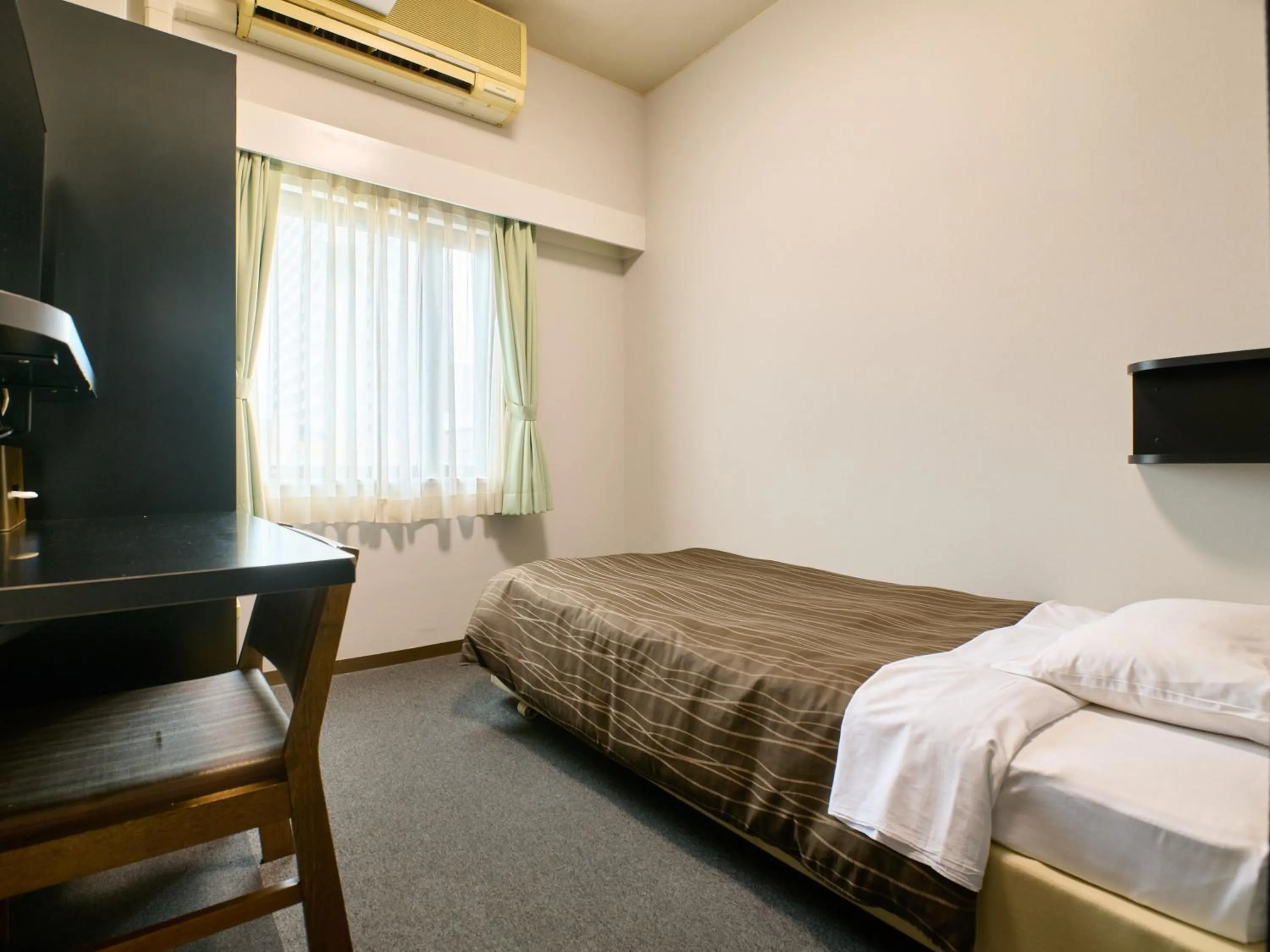 Bed in Tabist Hotel Seishokan