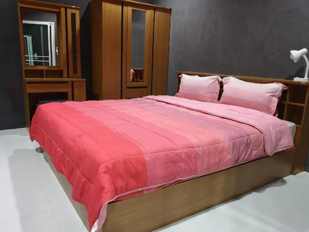 Bed in Baan Sabaijai Resort