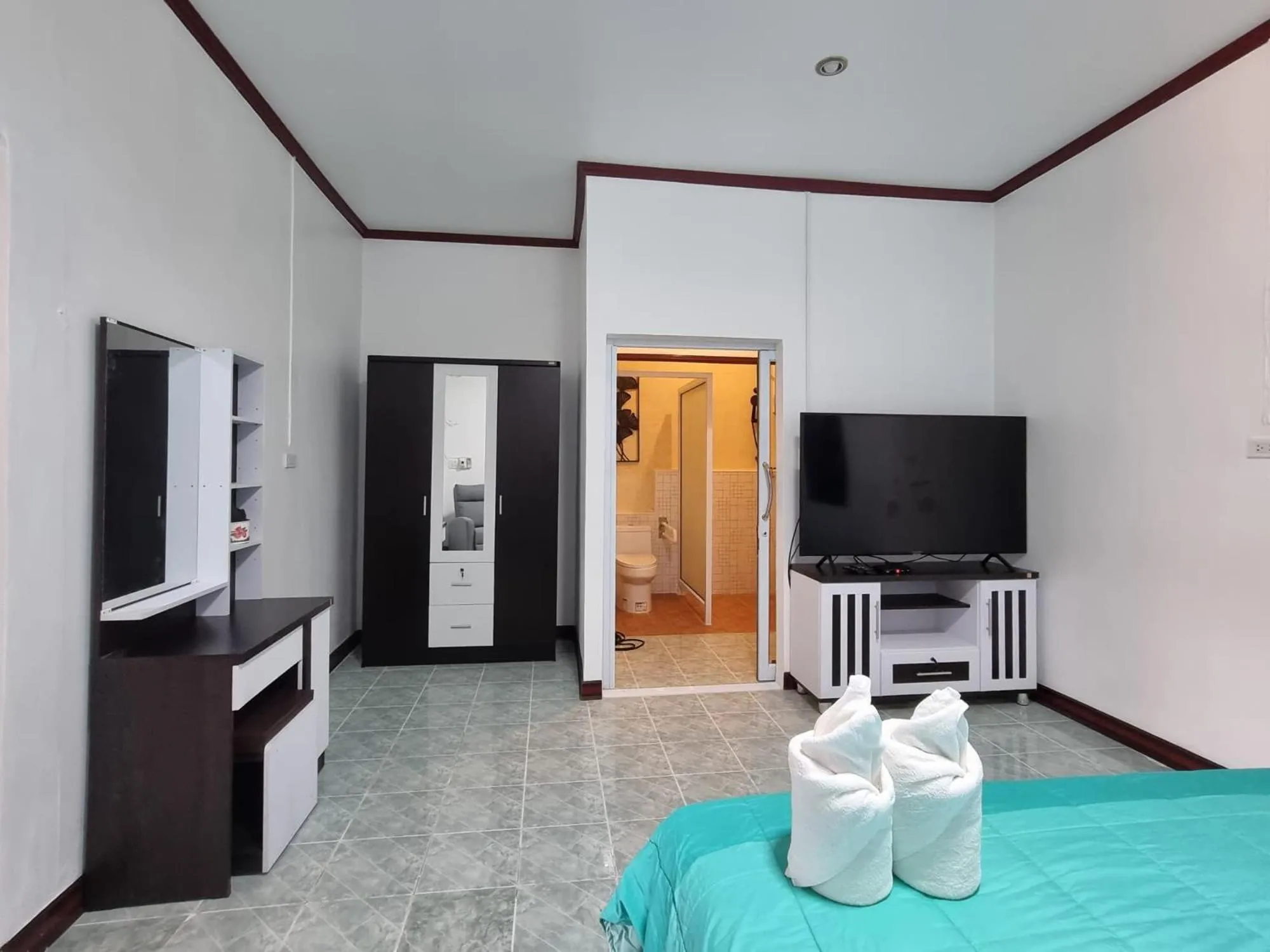 Bed in Baan Sabaijai Resort