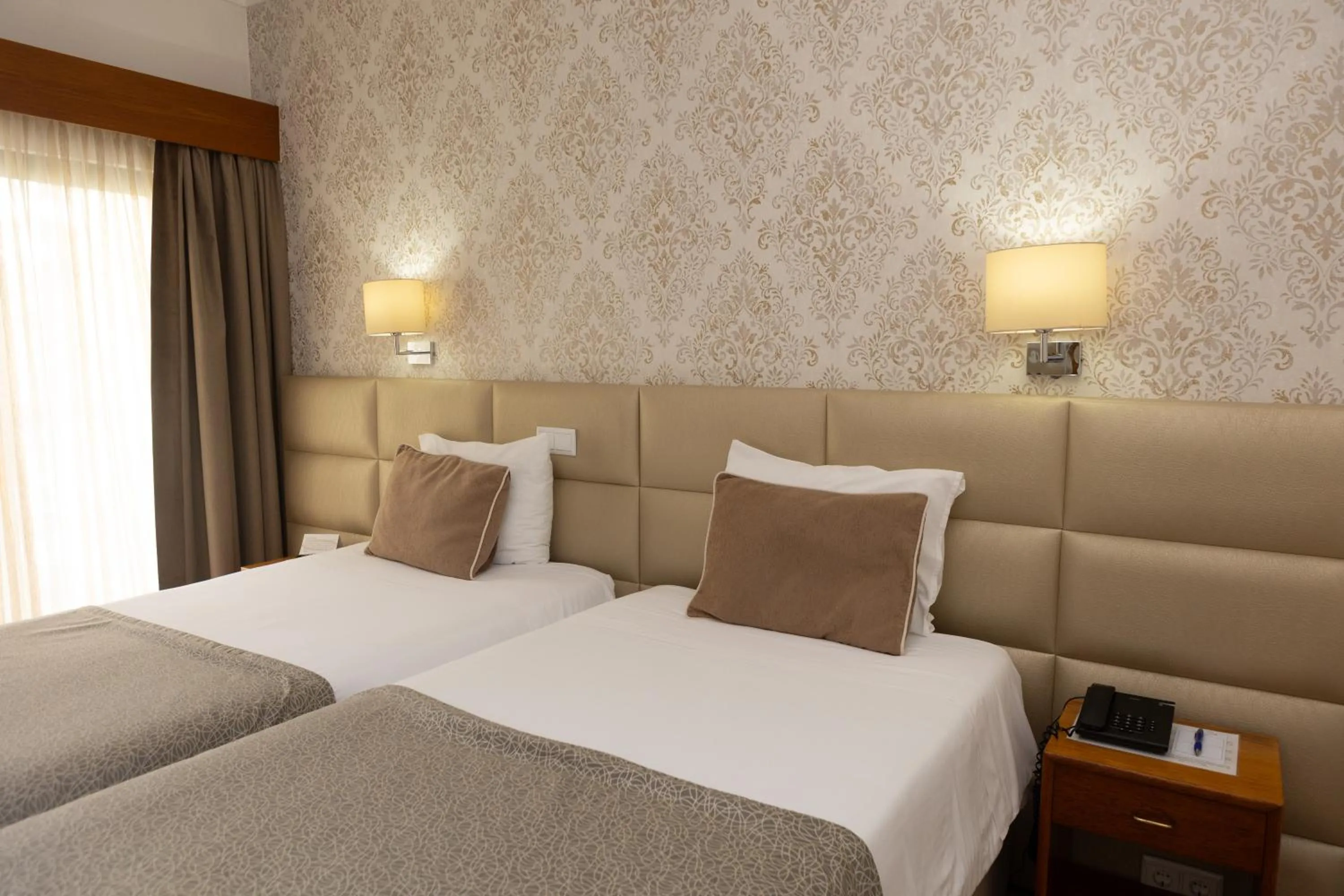 Bed in Hotel Sao Jorge Garden