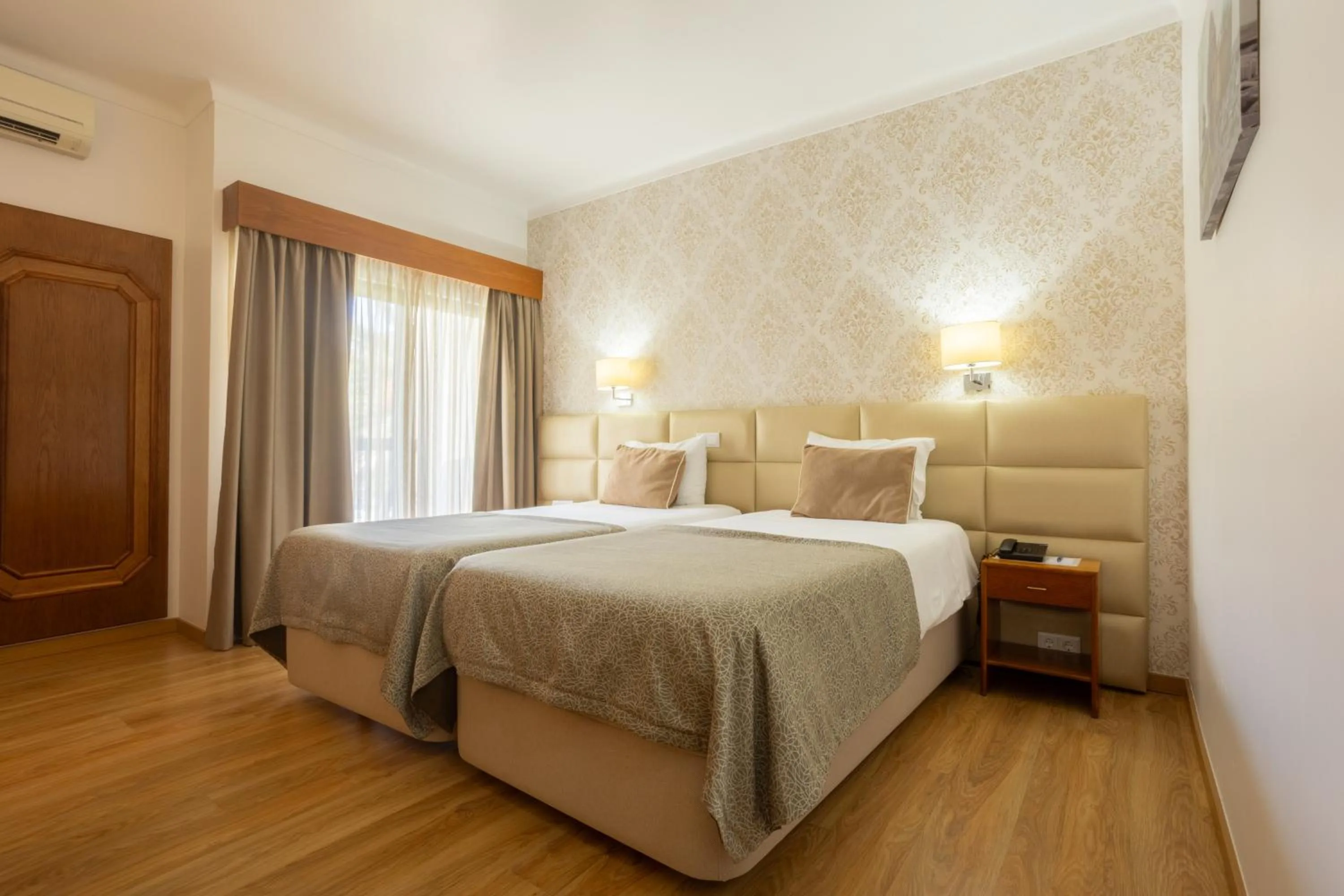 Bed in Hotel Sao Jorge Garden