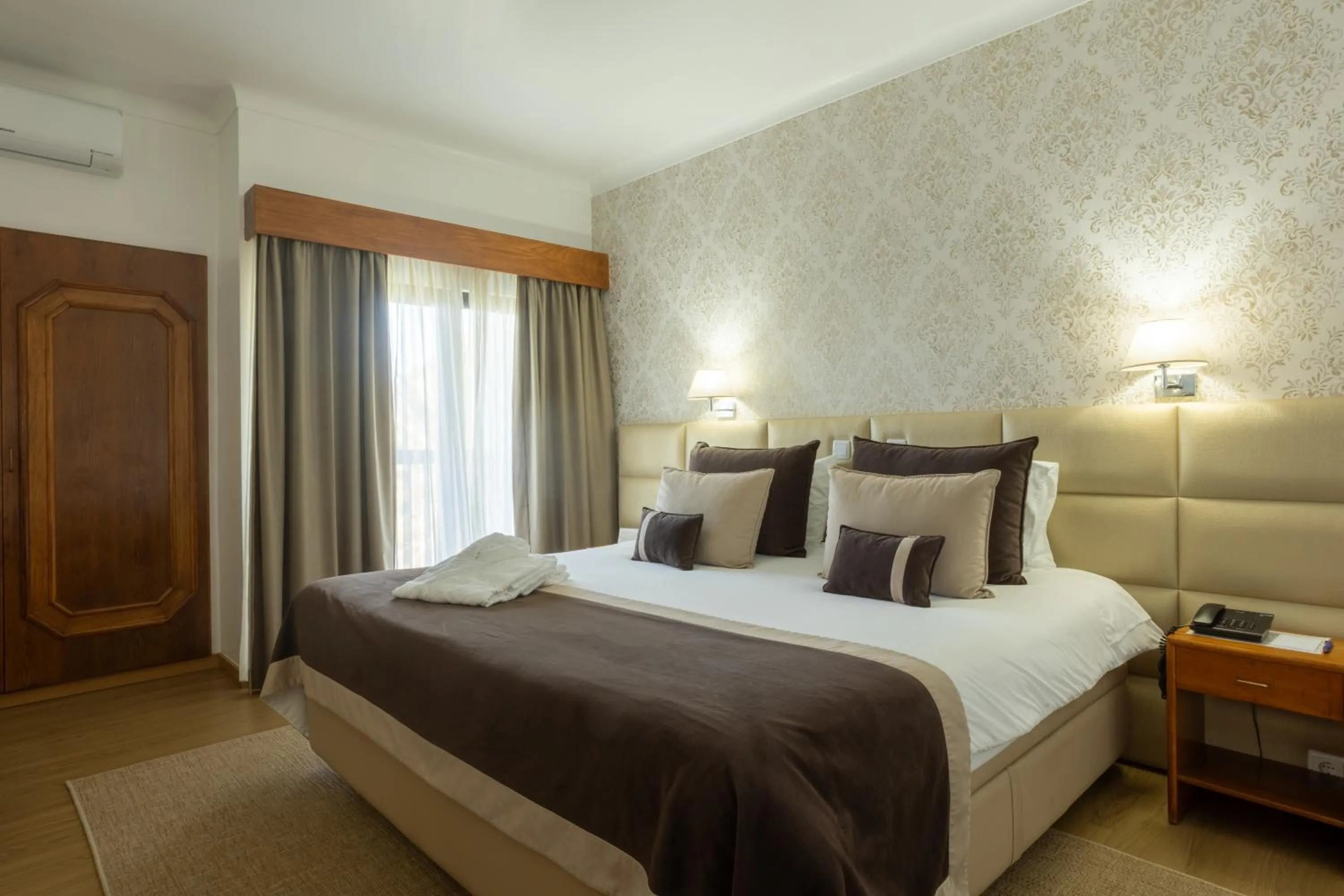 Bed in Hotel Sao Jorge Garden