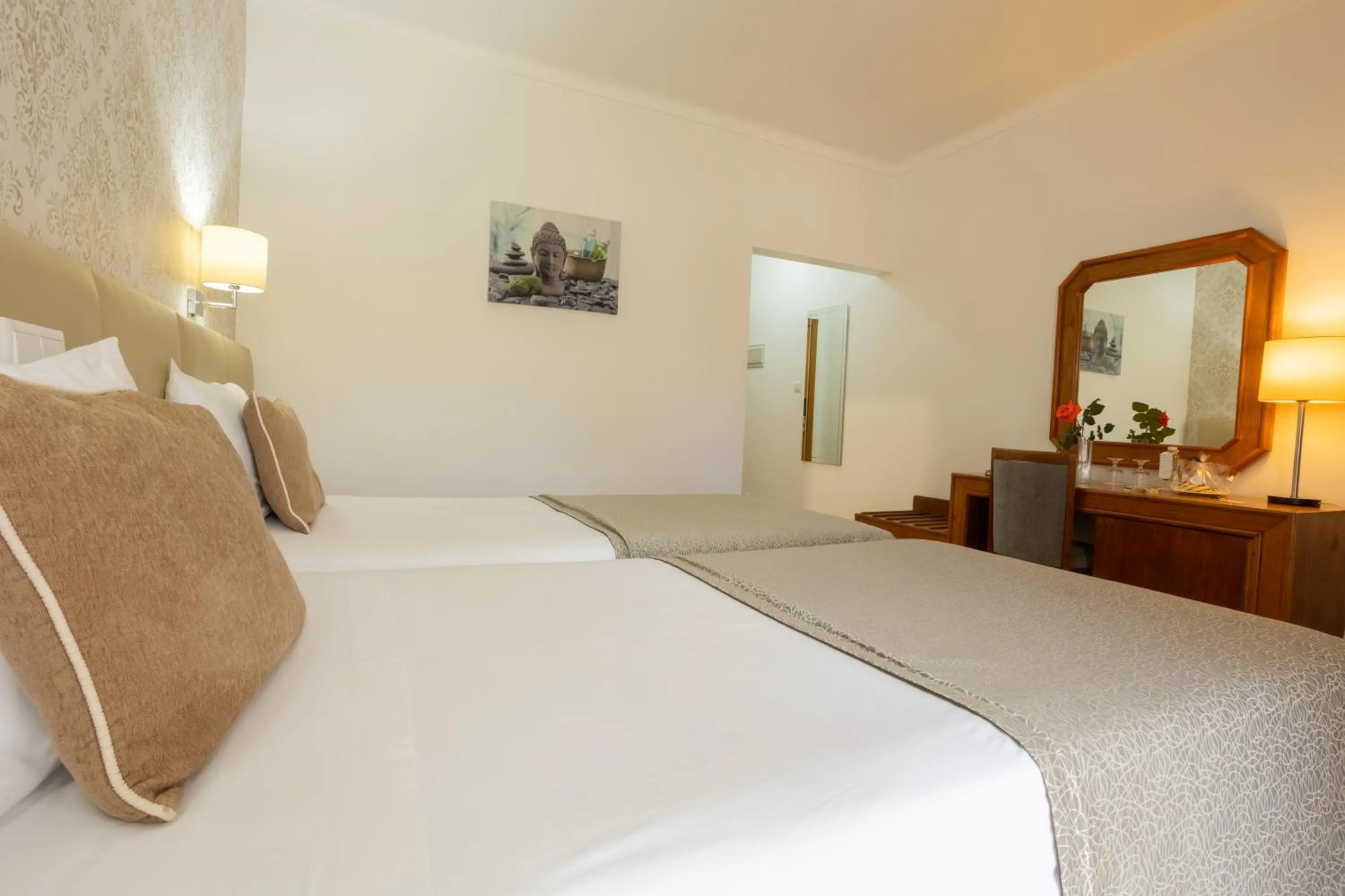 Bed in Hotel Sao Jorge Garden