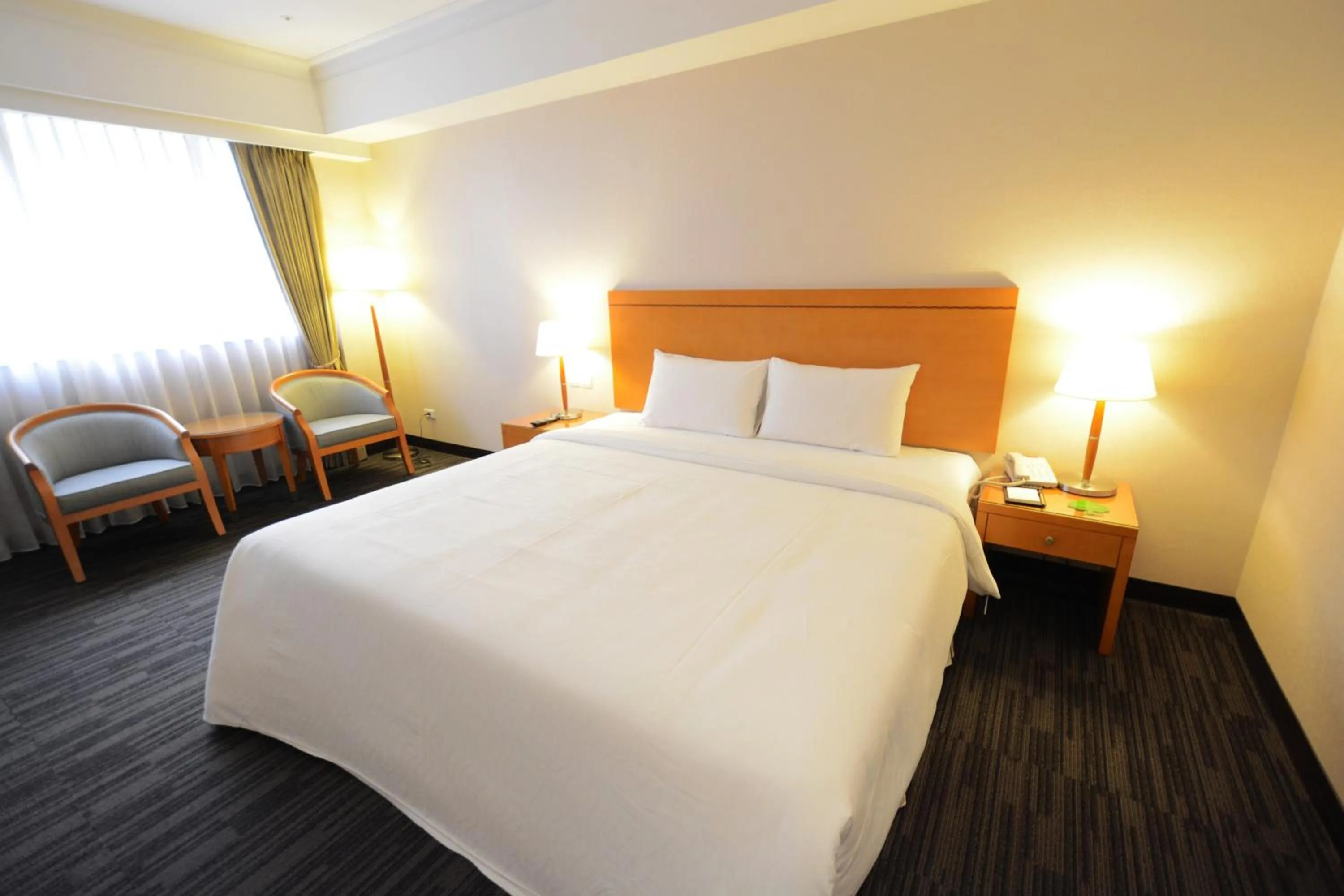 Bed in Fushin Hotel Taichung