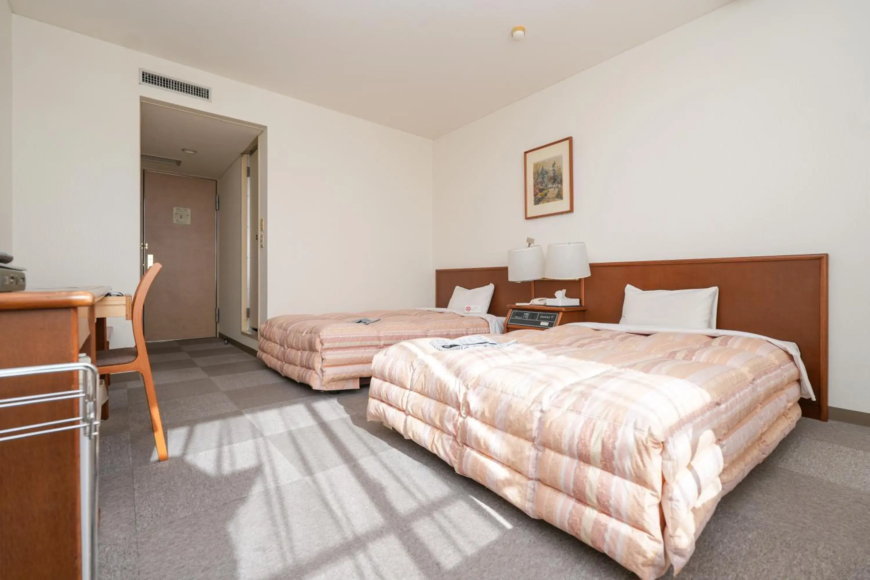 Bed in Tendo Central Hotel Bed in Tendo Central Hotel