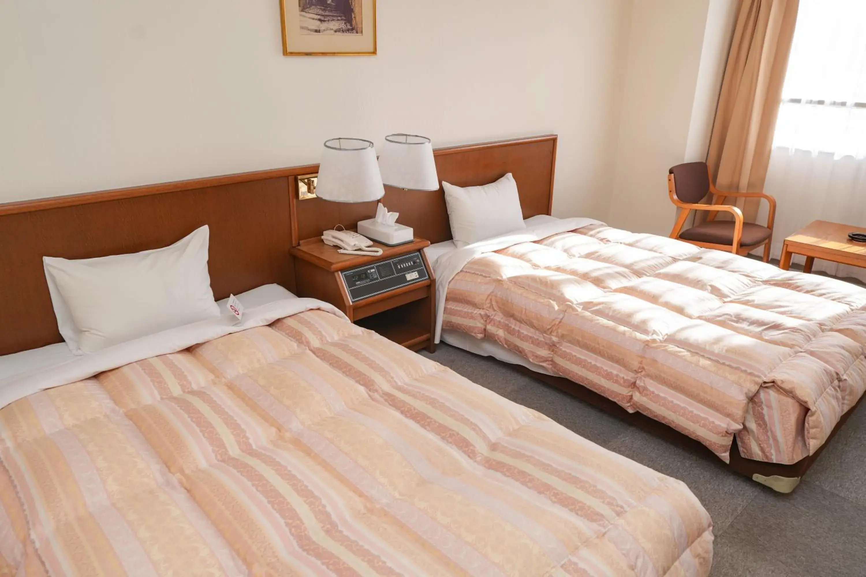 Bed in Tendo Central Hotel Bed in Tendo Central Hotel