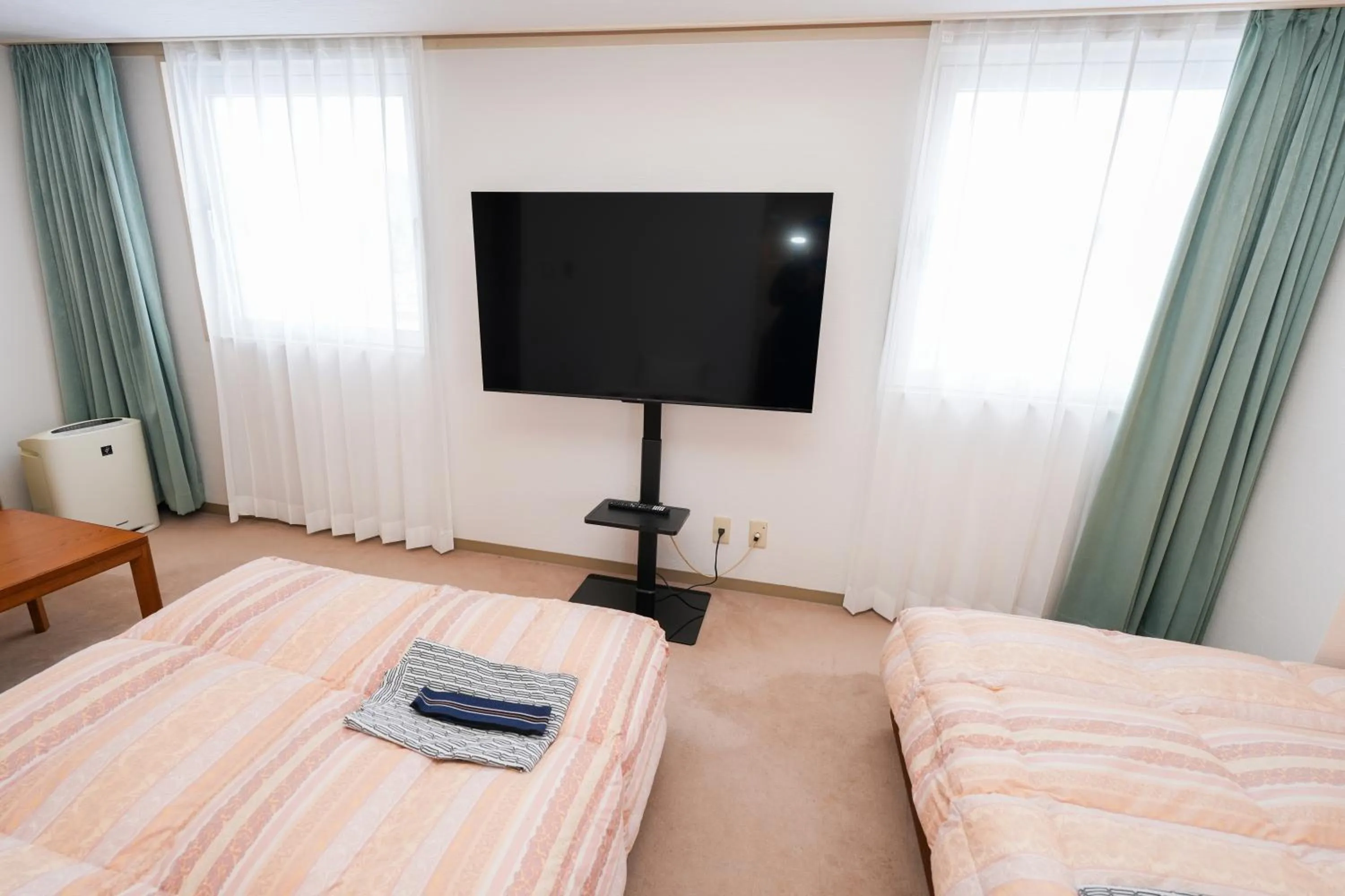 Bed in Tendo Central Hotel