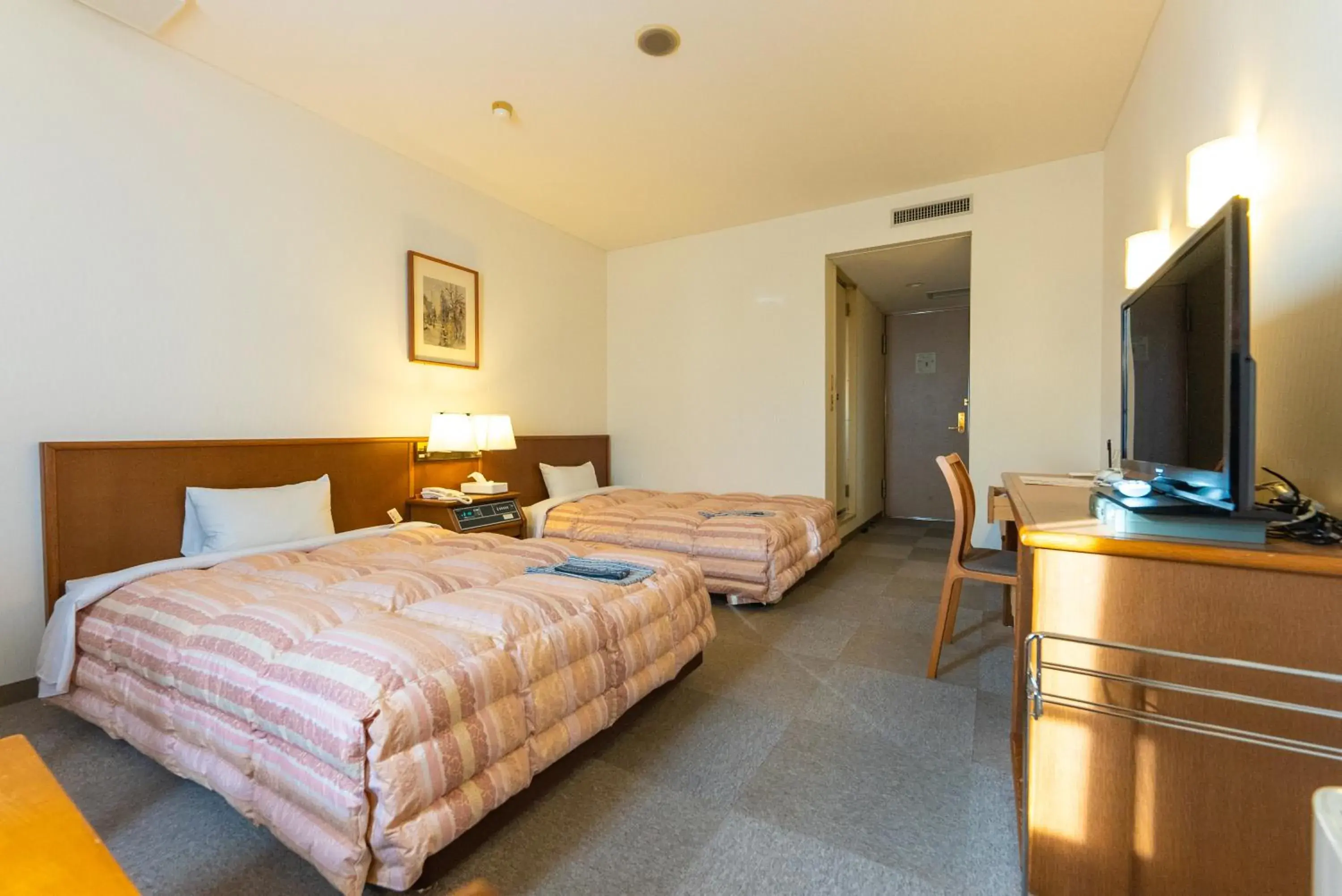 Bed in Tendo Central Hotel Bed in Tendo Central Hotel