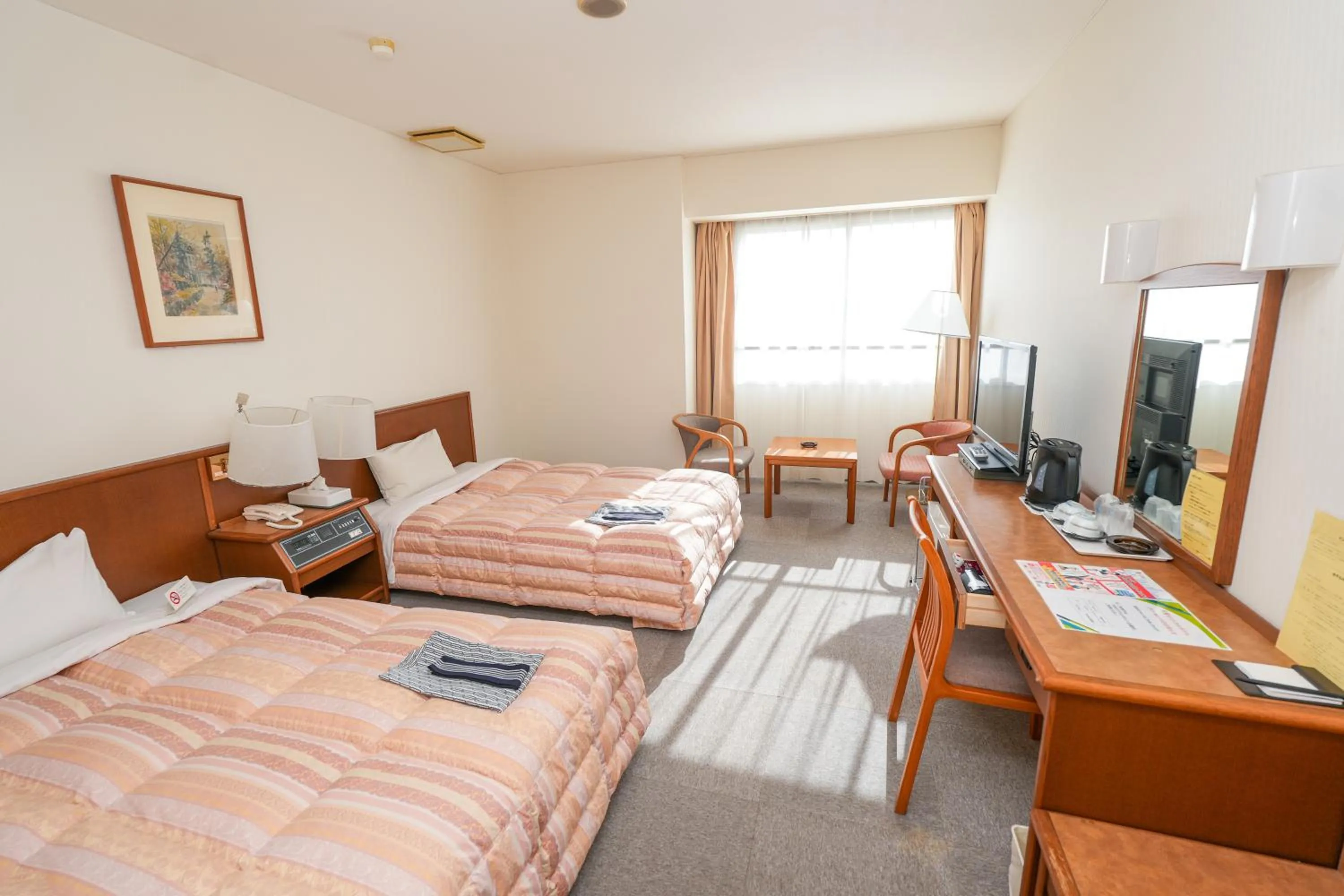 Bed in Tendo Central Hotel