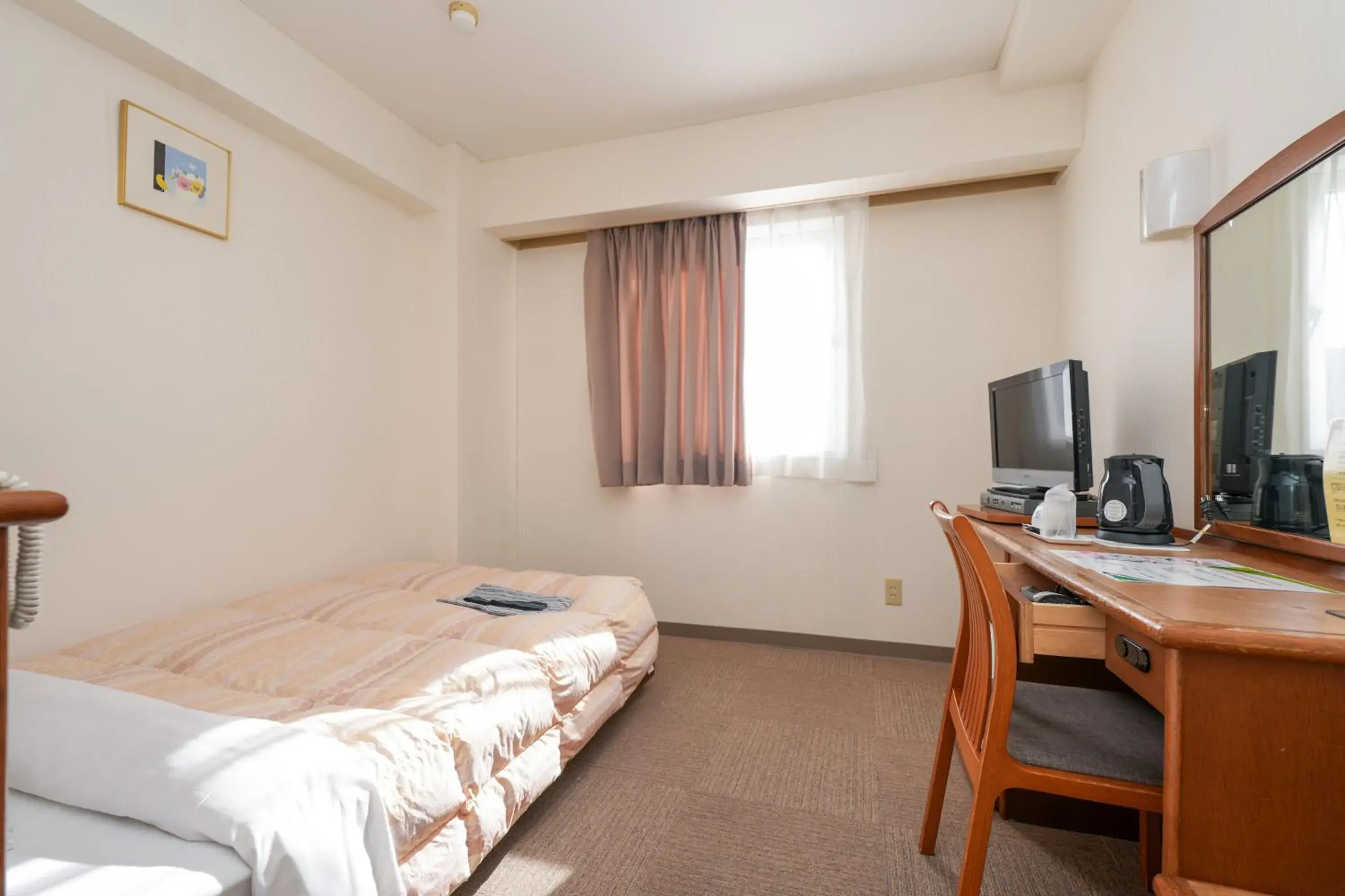 Bed in Tendo Central Hotel Bed in Tendo Central Hotel