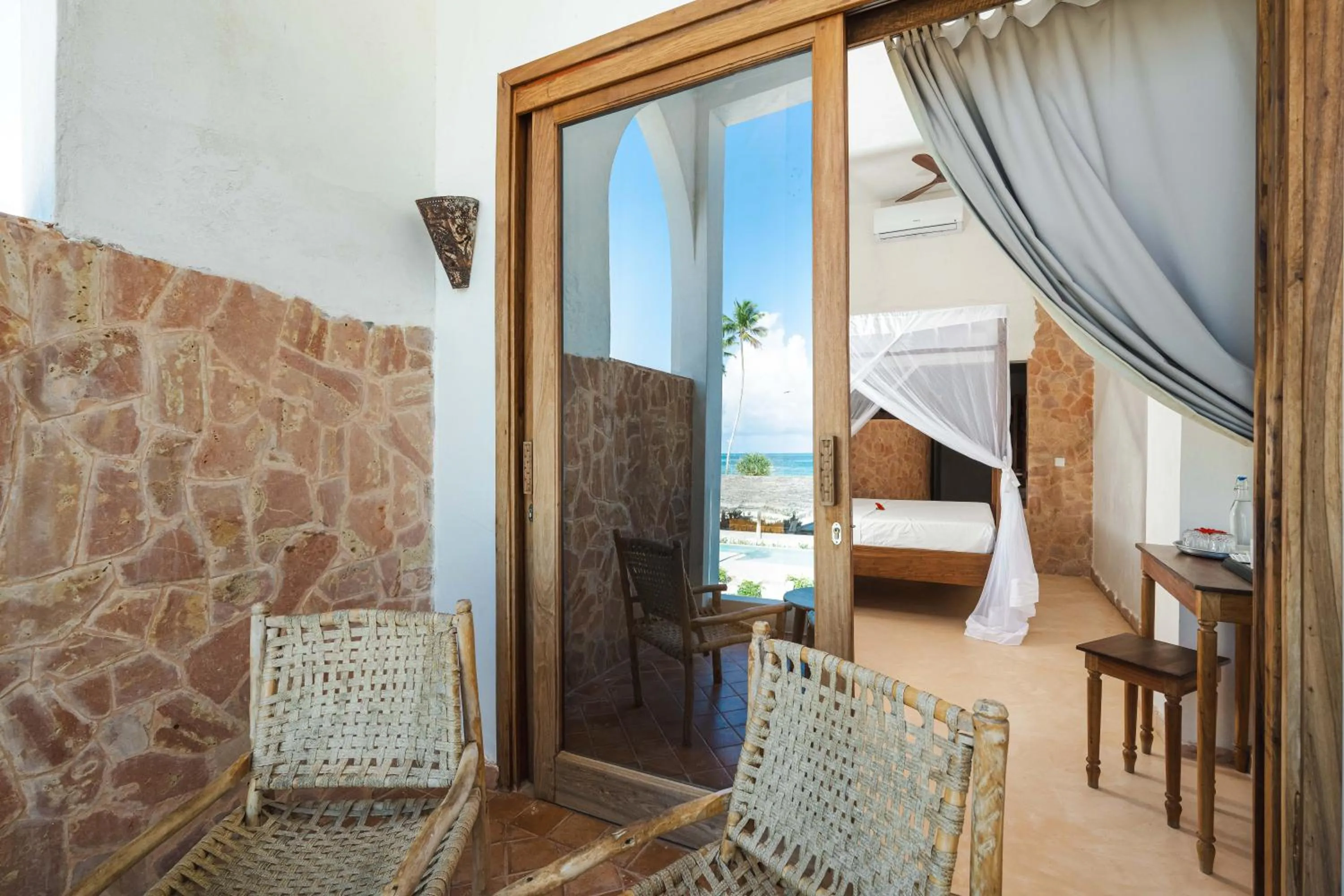 Balcony/Terrace, Bed in Mvuvi Boutique Resort