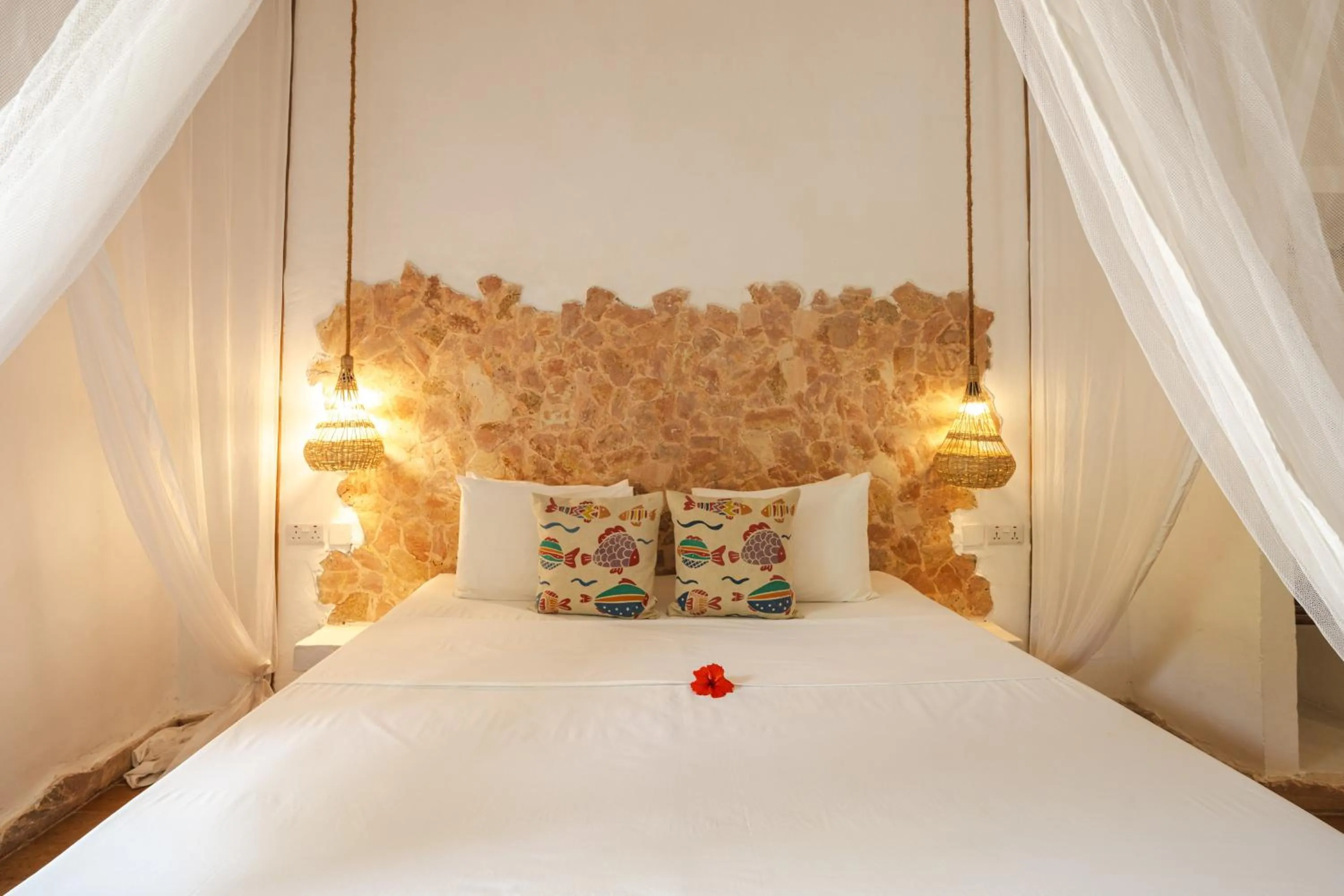 Bed in Mvuvi Boutique Resort