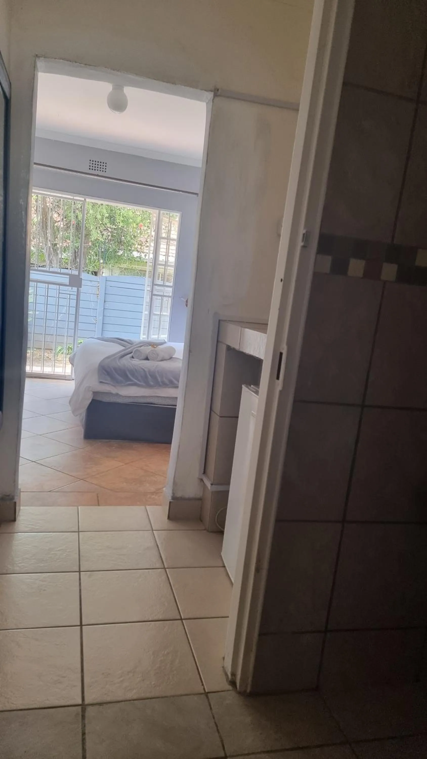 Bed in Stay at Home Airport Lodge