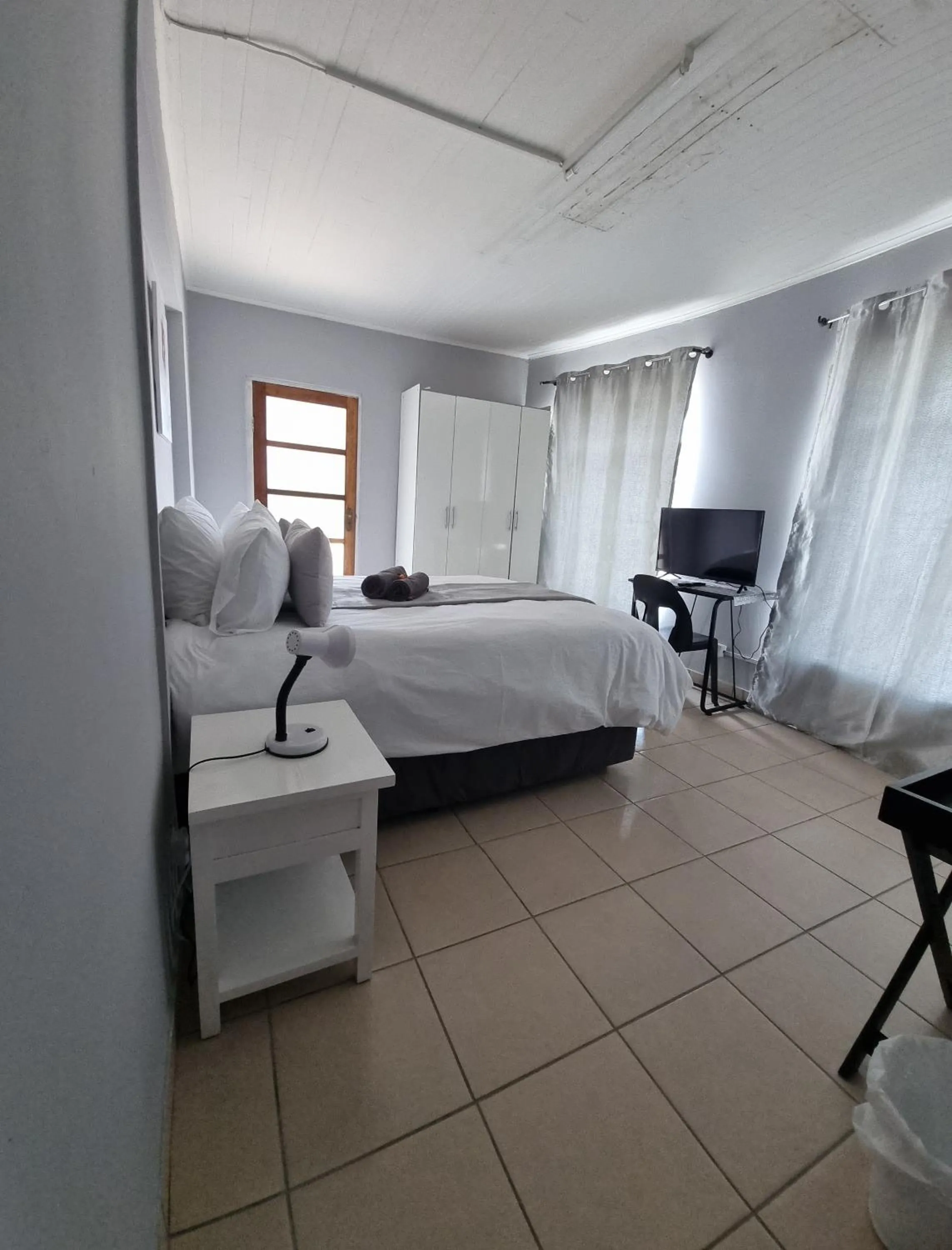 Bed in Stay at Home Airport Lodge