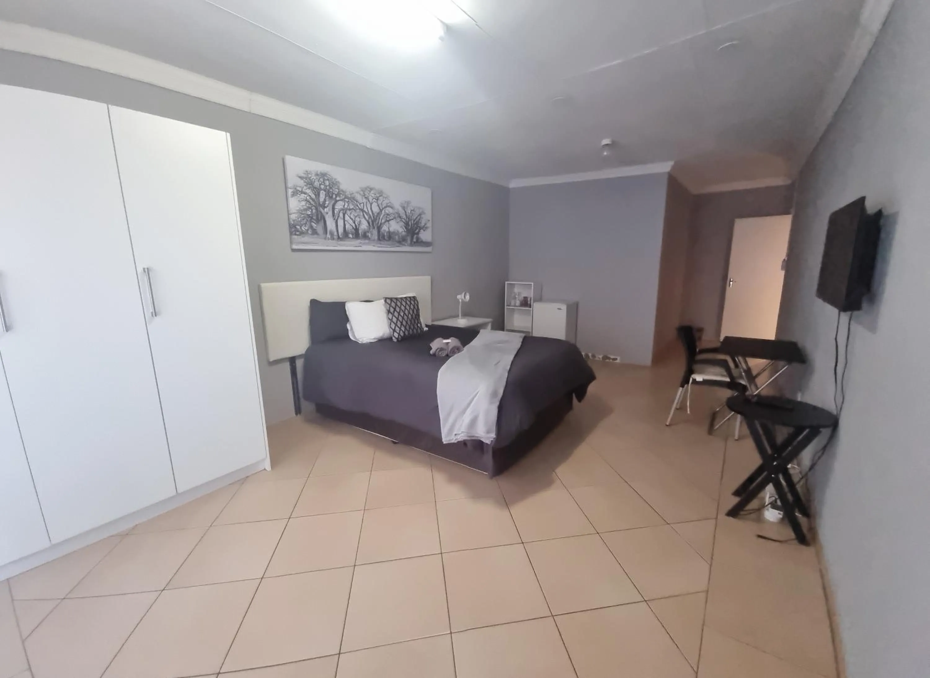 Bed in Stay at Home Airport Lodge
