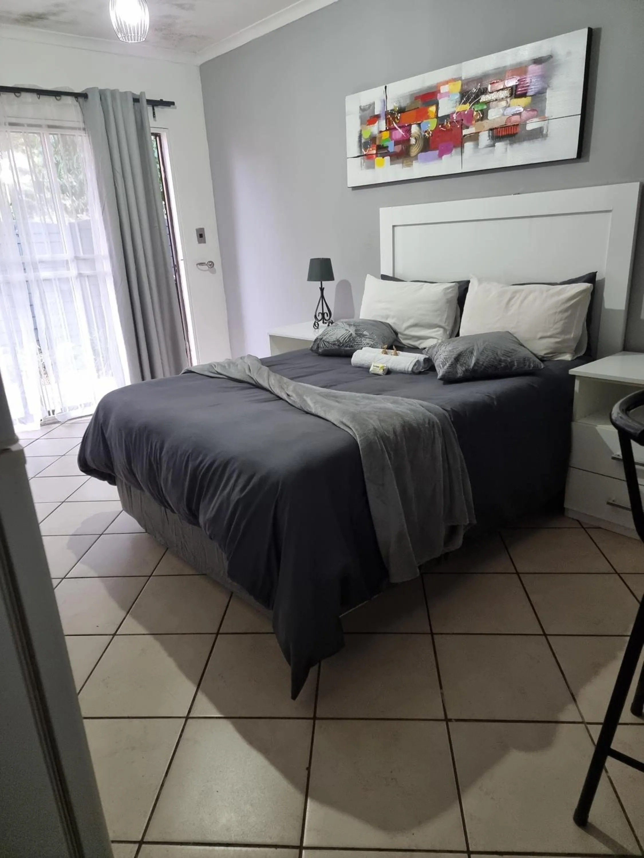 Bed in Stay at Home Airport Lodge