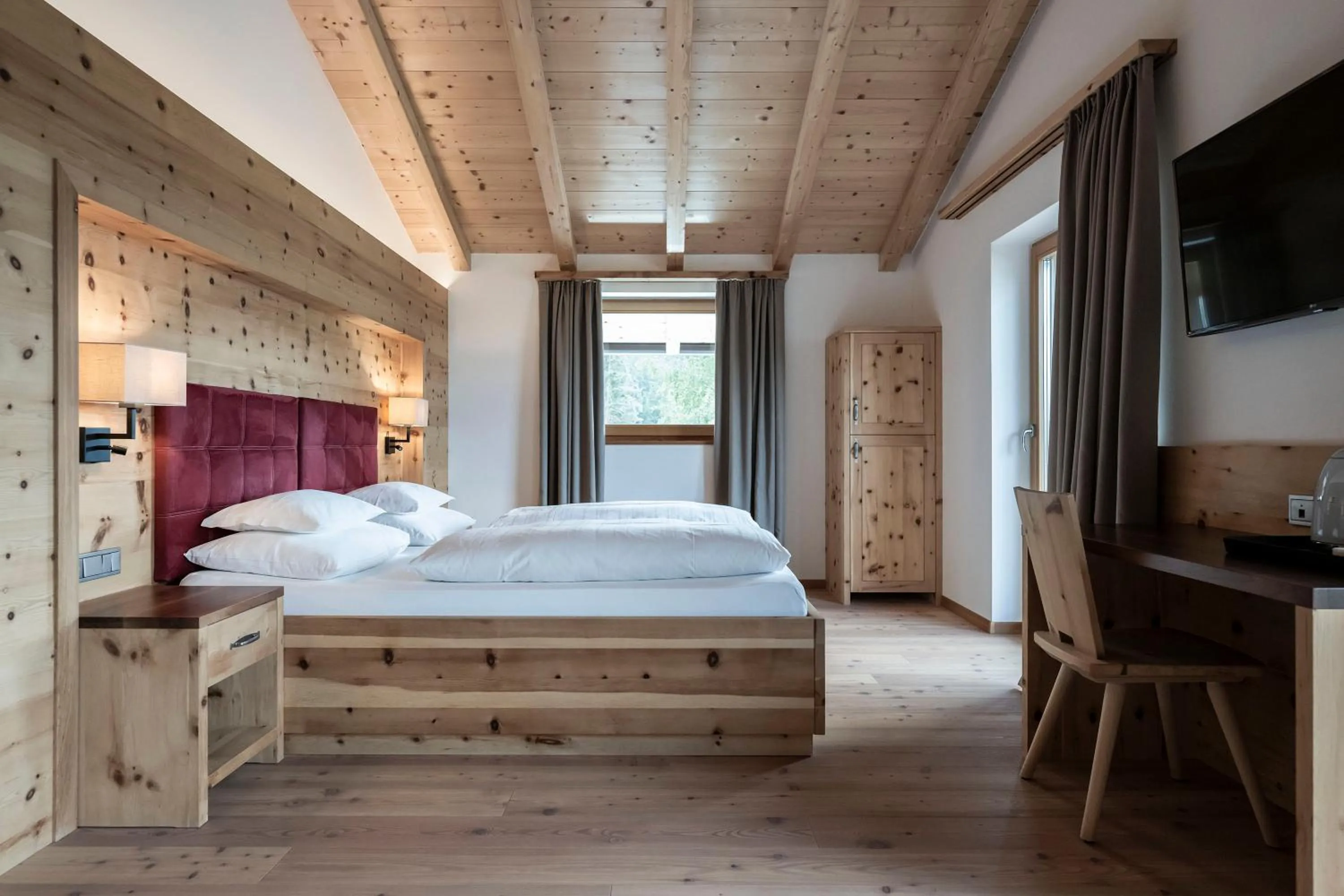 Photo of the whole room, Bed in Dolomites Nature Hotel Vigilerhof
