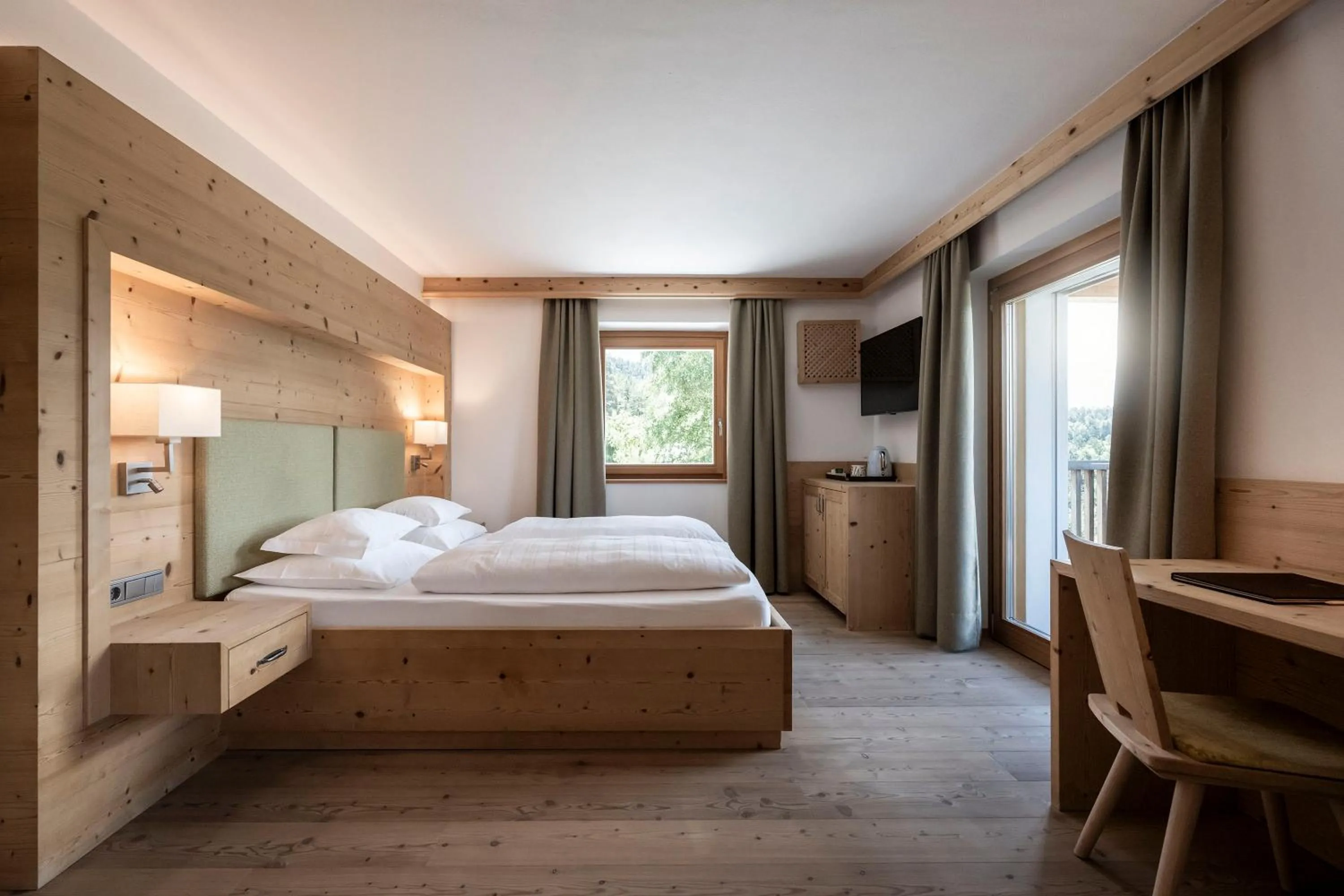 Photo of the whole room, Bed in Dolomites Nature Hotel Vigilerhof
