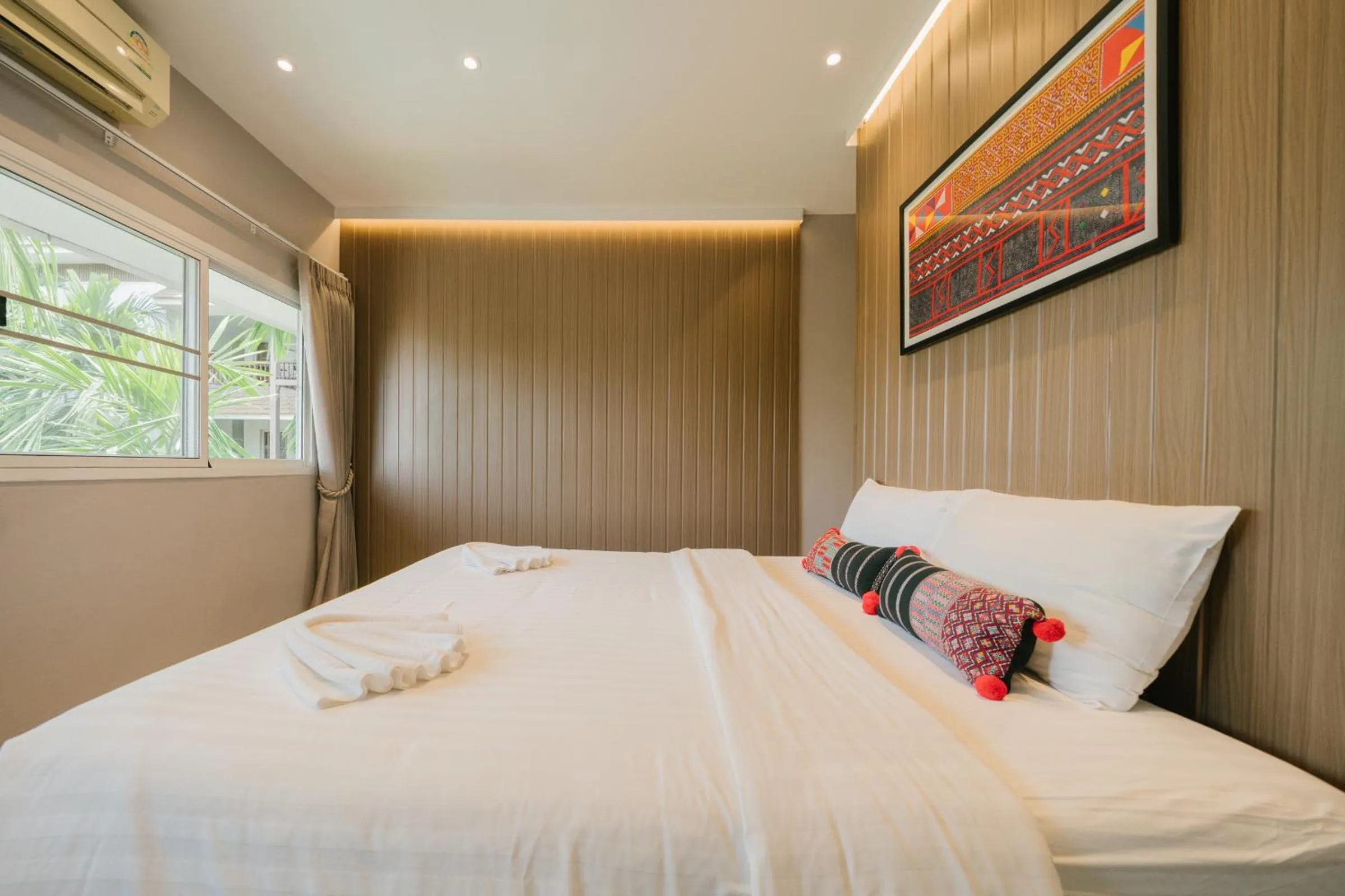 Bed in The Opium Chiang Mai