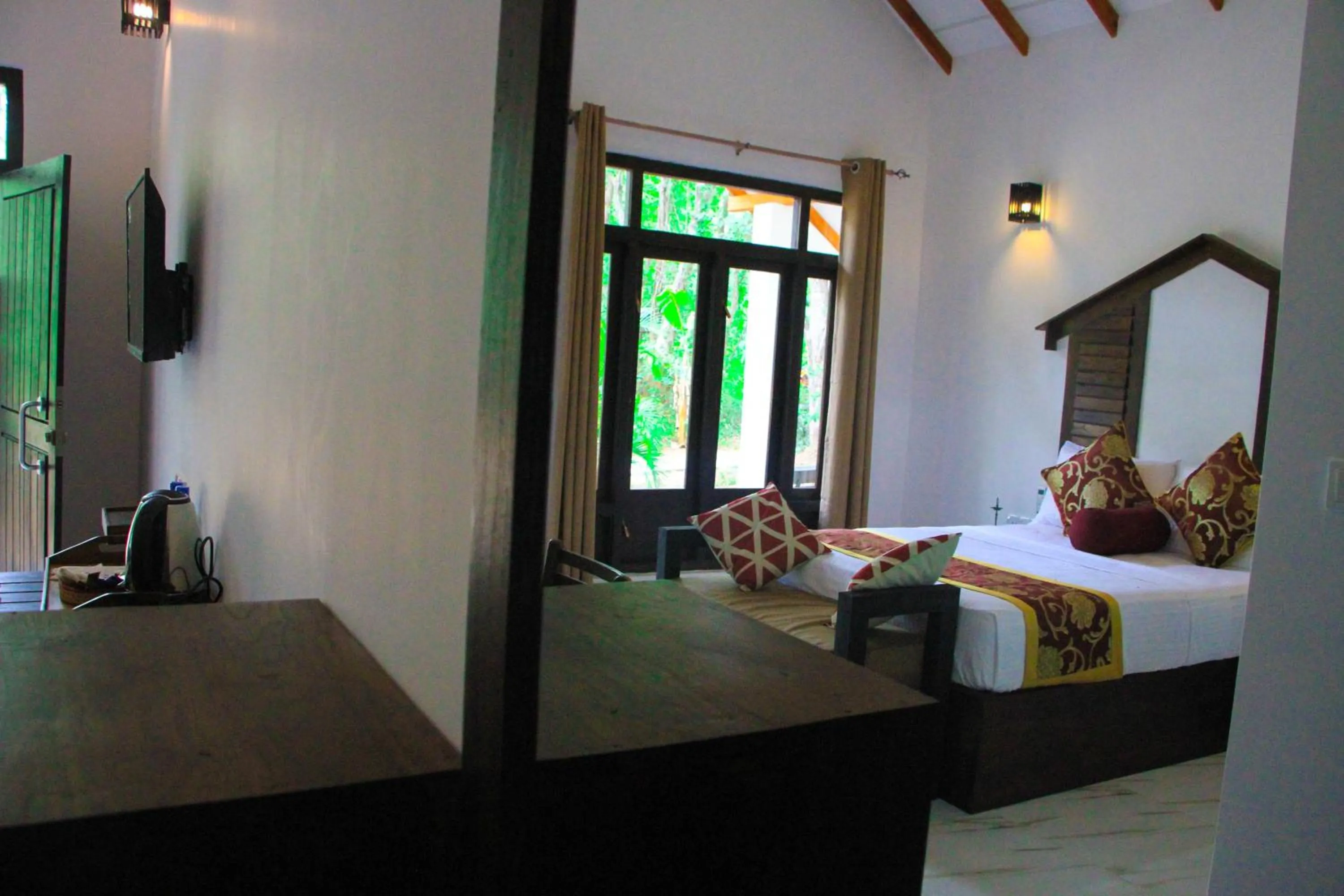 Bed in Palmyra Nature Resort Sigiriya