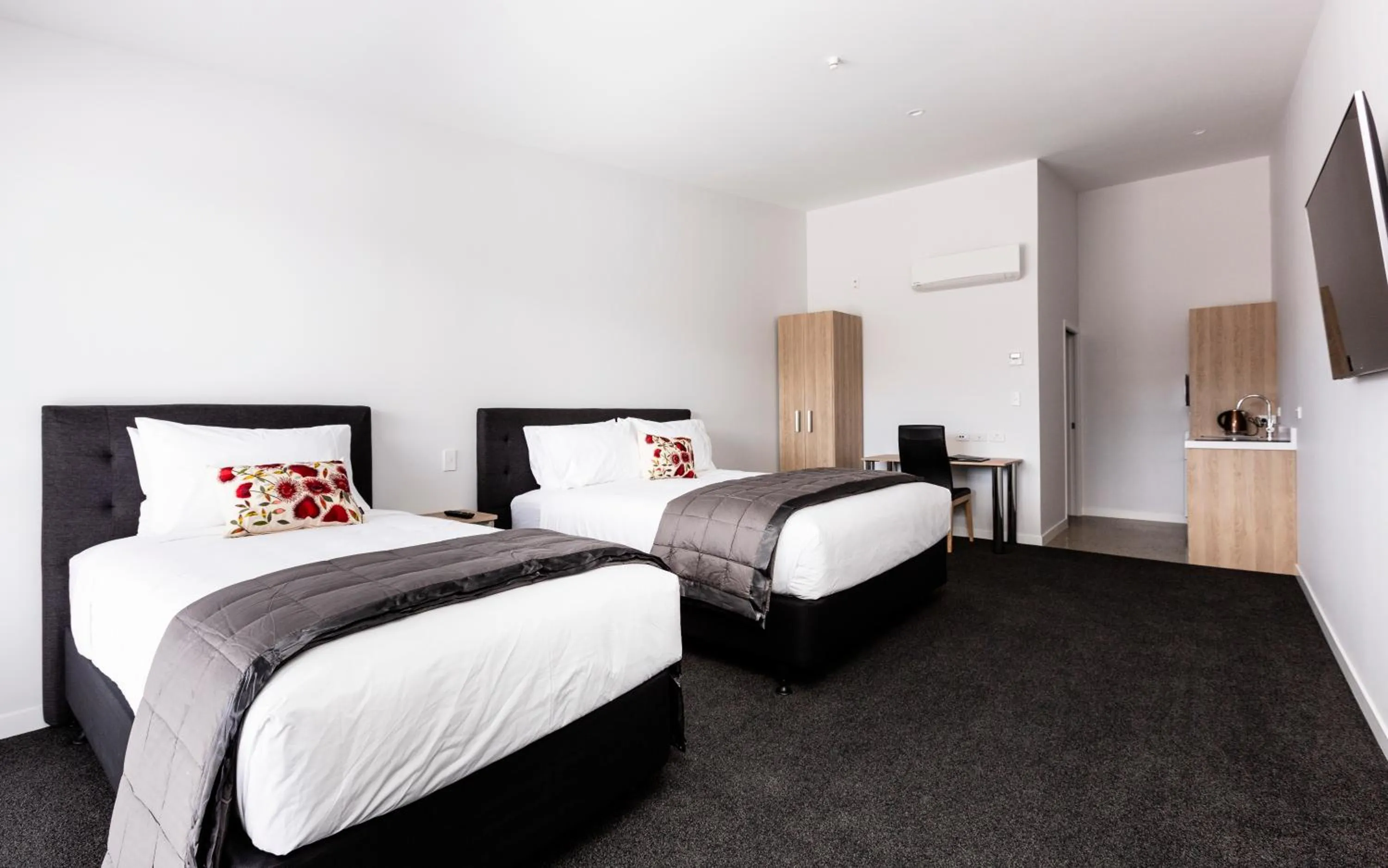 Bed in Zachary's Motel