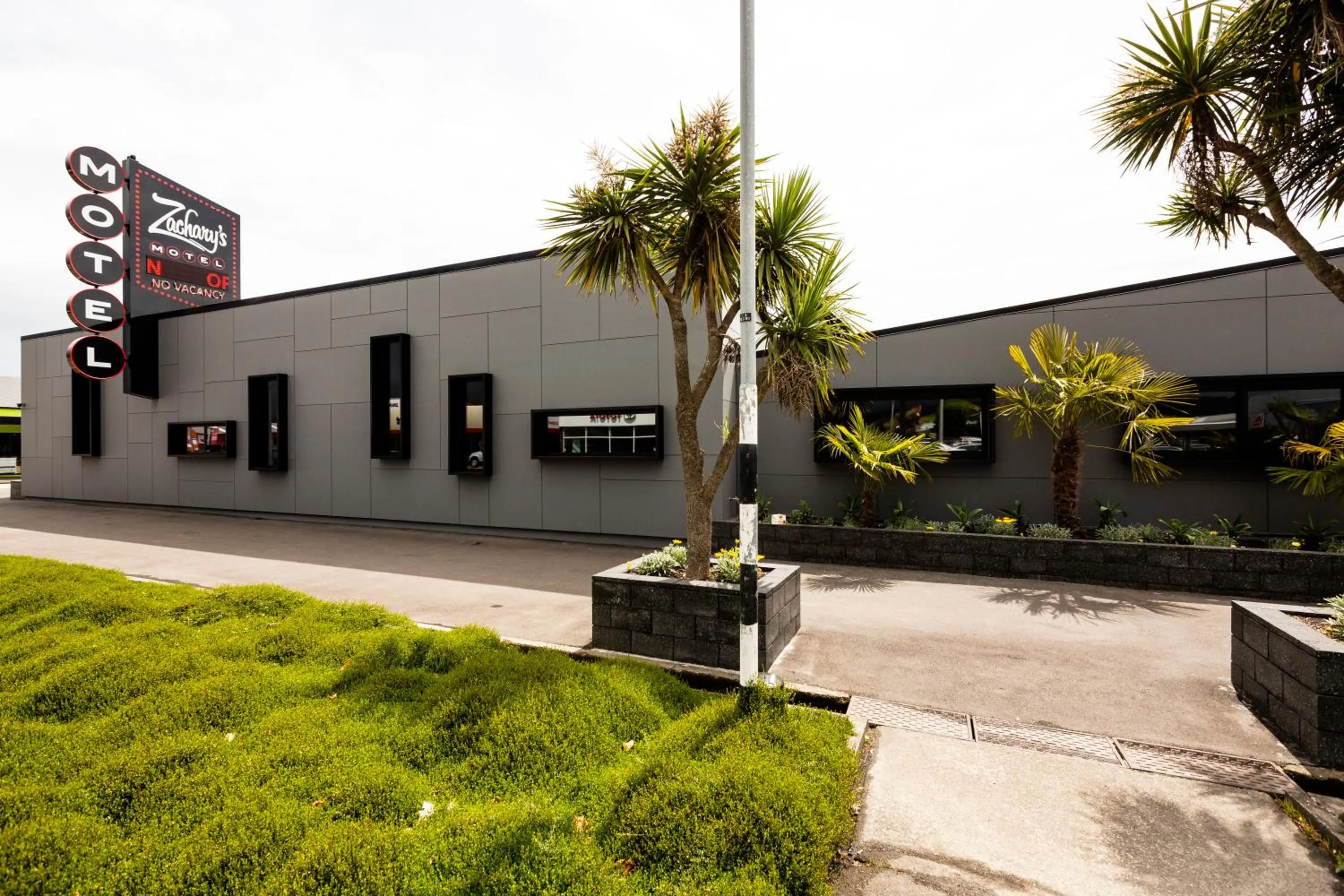 Property logo or sign in Zachary's Motel