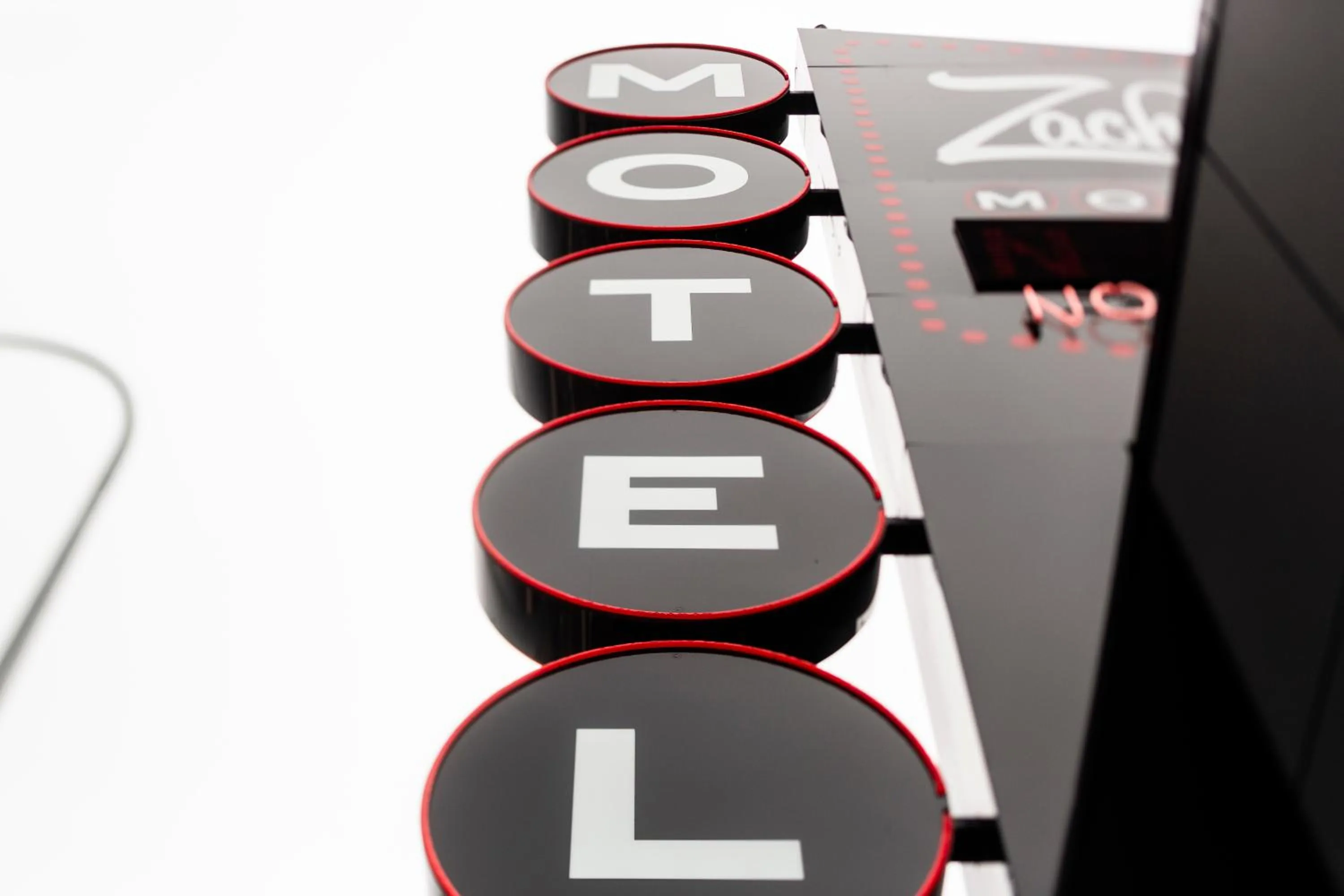 Property logo or sign in Zachary's Motel