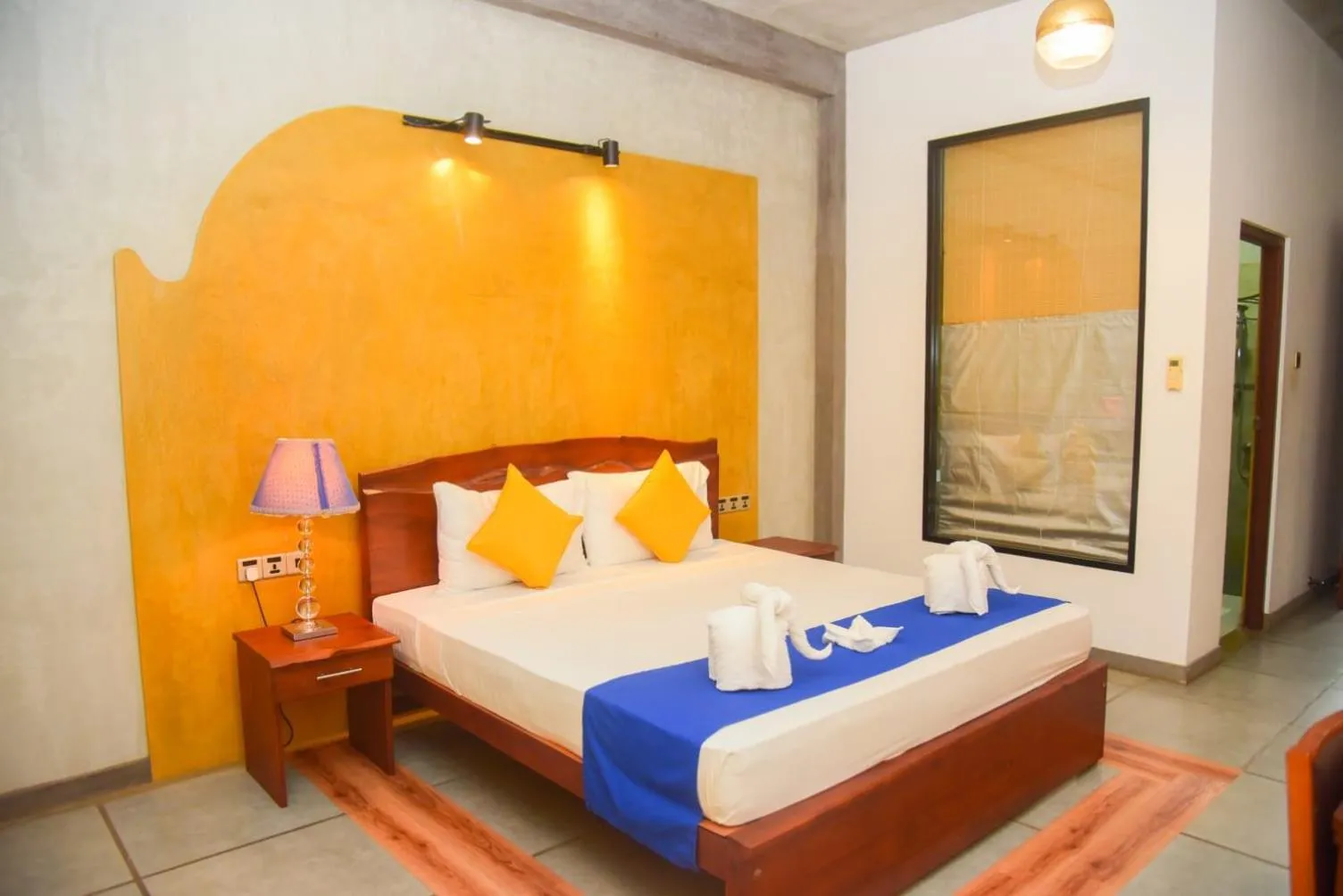 Bed in Royal Tusker Hotel