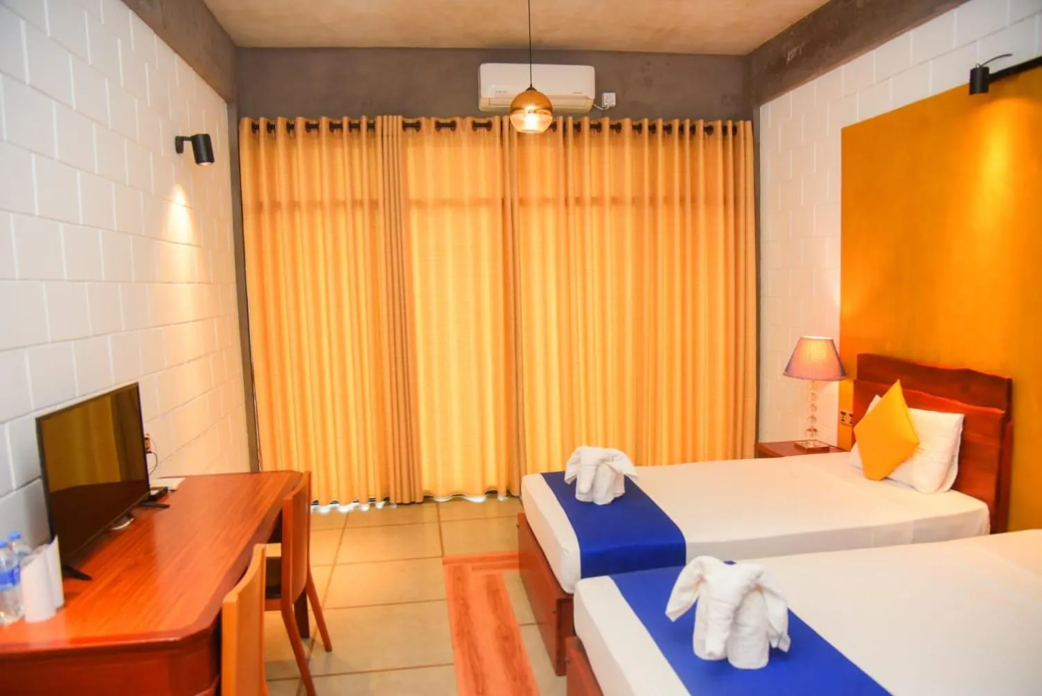 Bed in Royal Tusker Hotel