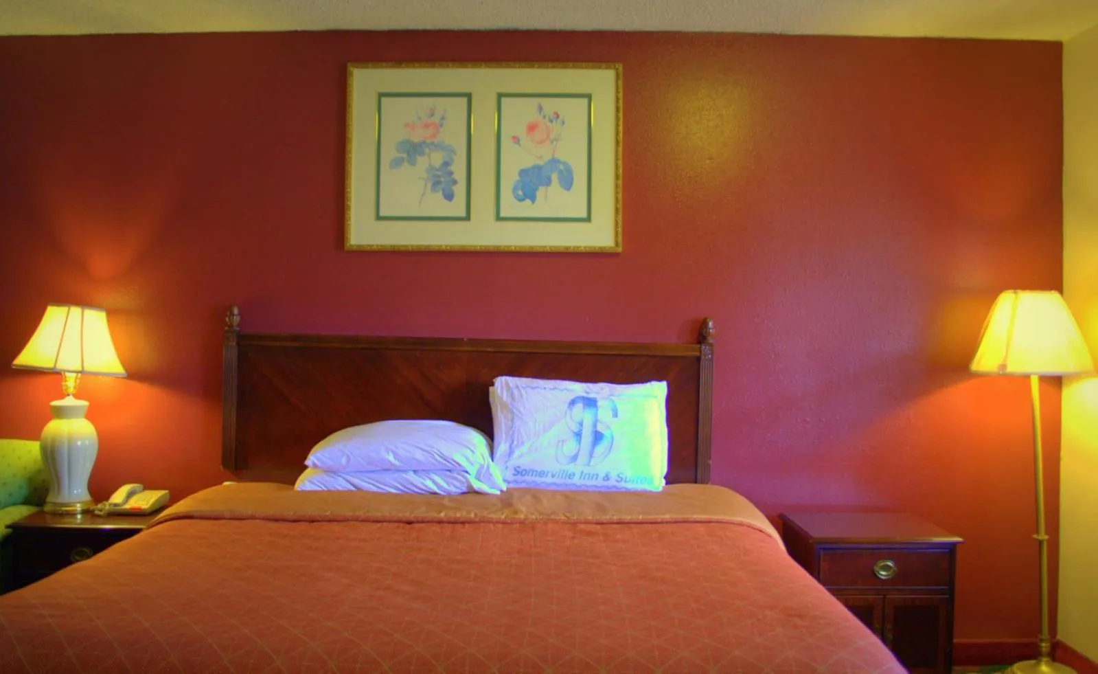 Bed in Somerville Inn and Suites