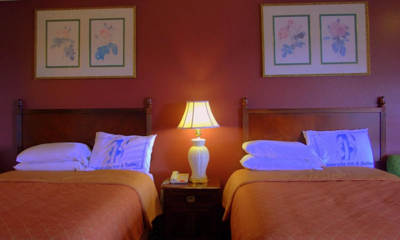 Bed in Somerville Inn and Suites