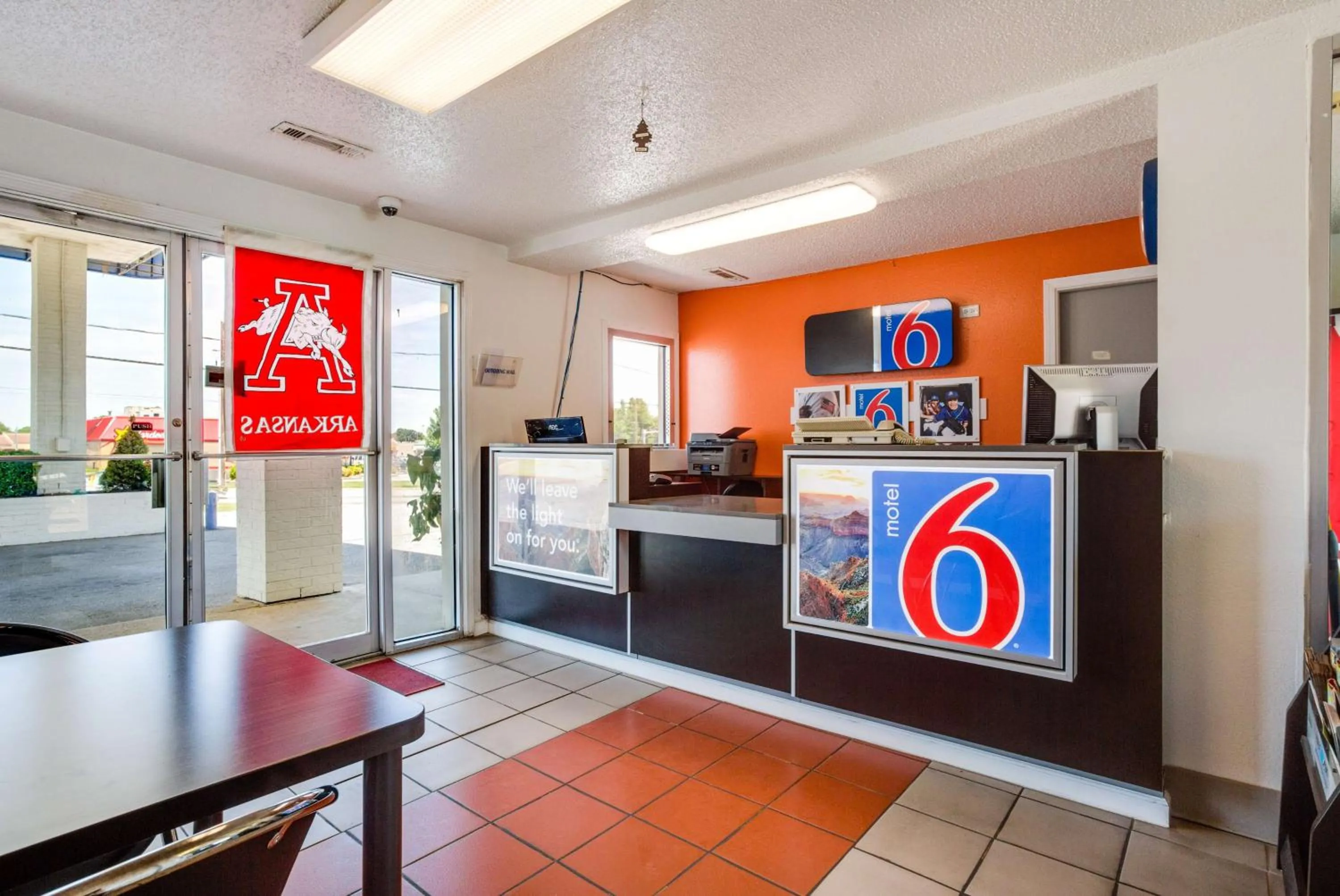 Property logo or sign in Motel 6-Fayetteville, AR