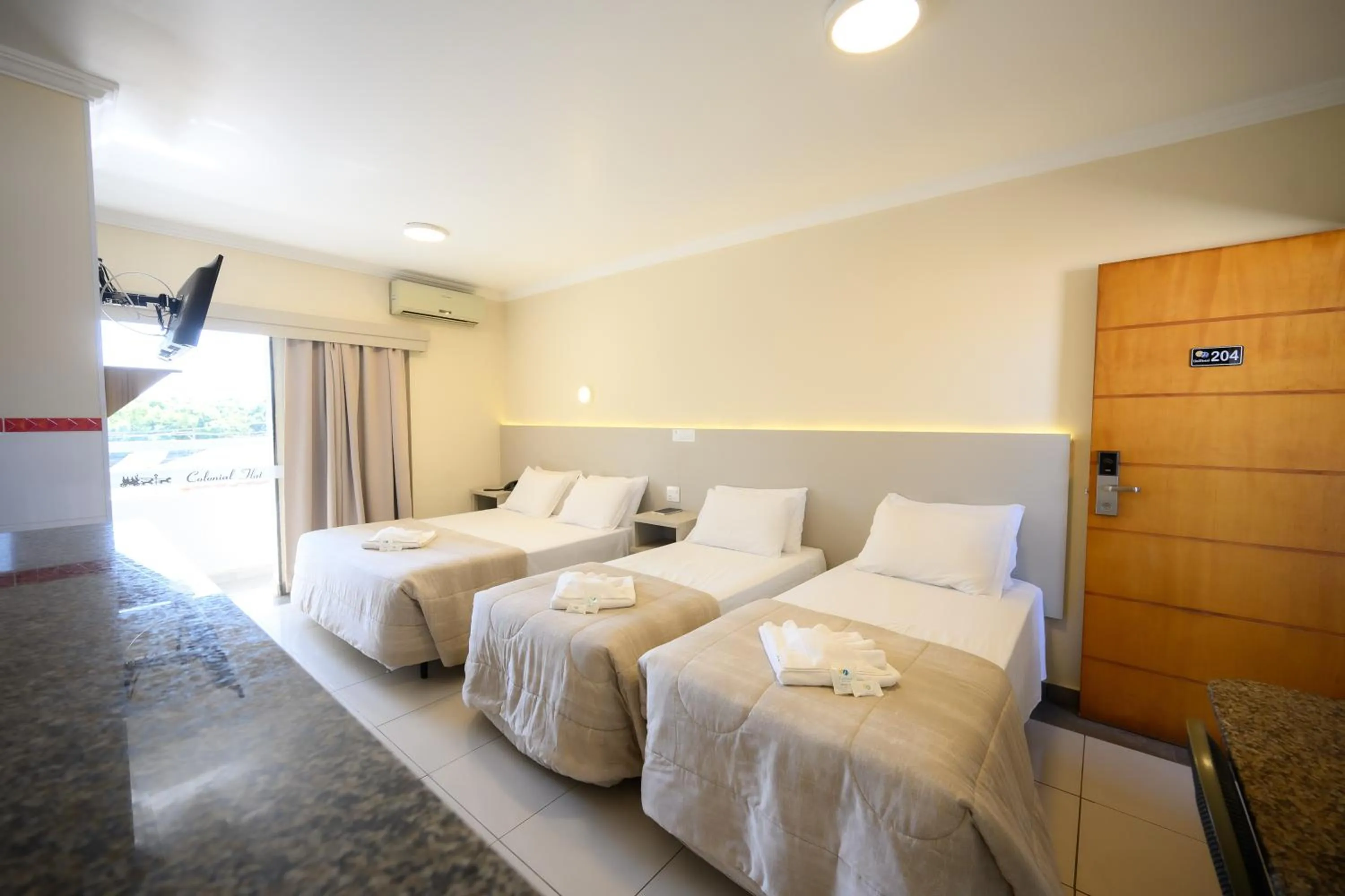 Bed in Colonial Flat Hotel