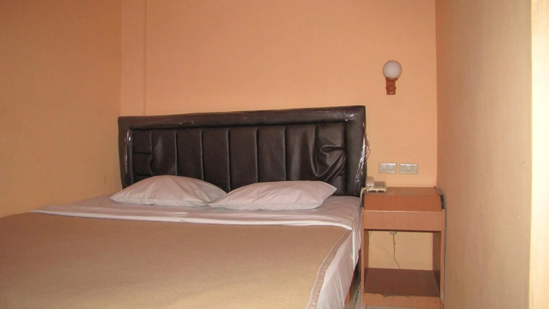 Bed in Hotel Mitra Garden