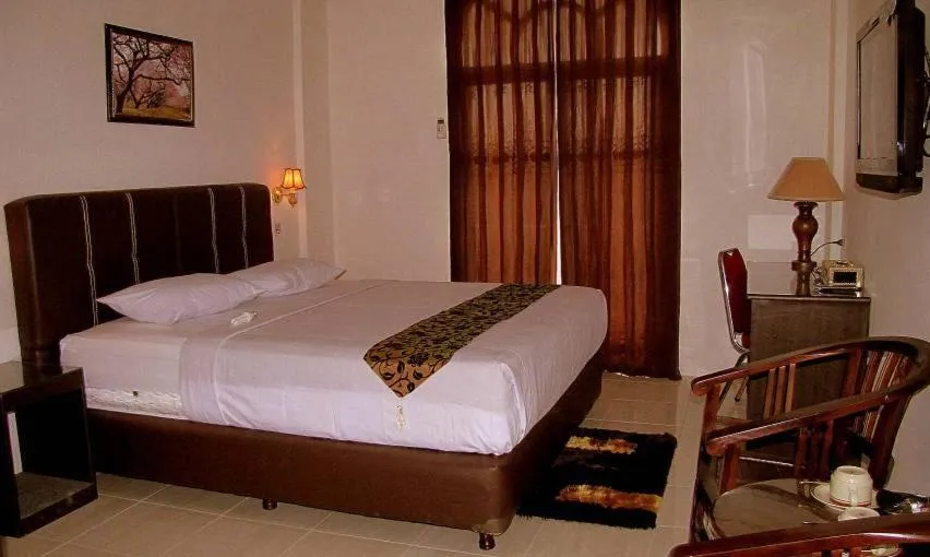 Bed in Hotel Mitra Garden