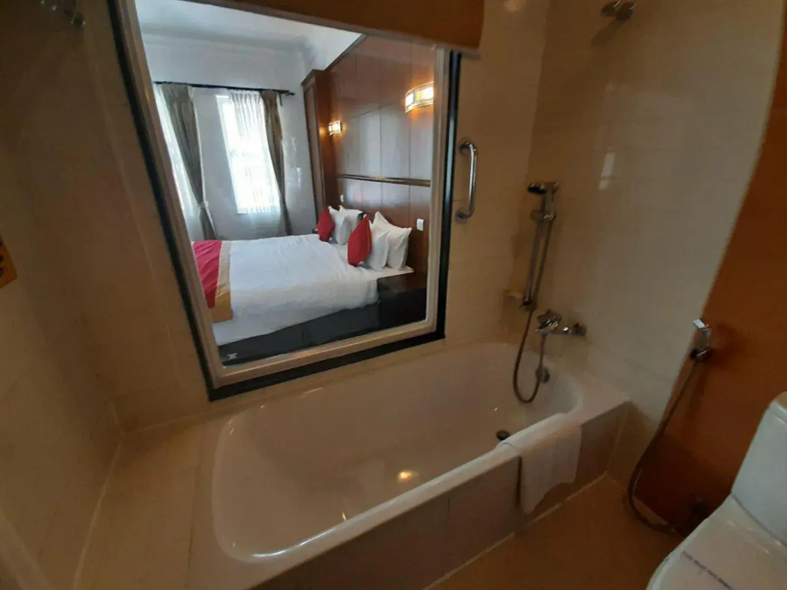 Bathroom, Bed in Waterfront Resort by KGH Group Bathroom, Bed in Waterfront Resort by KGH Group