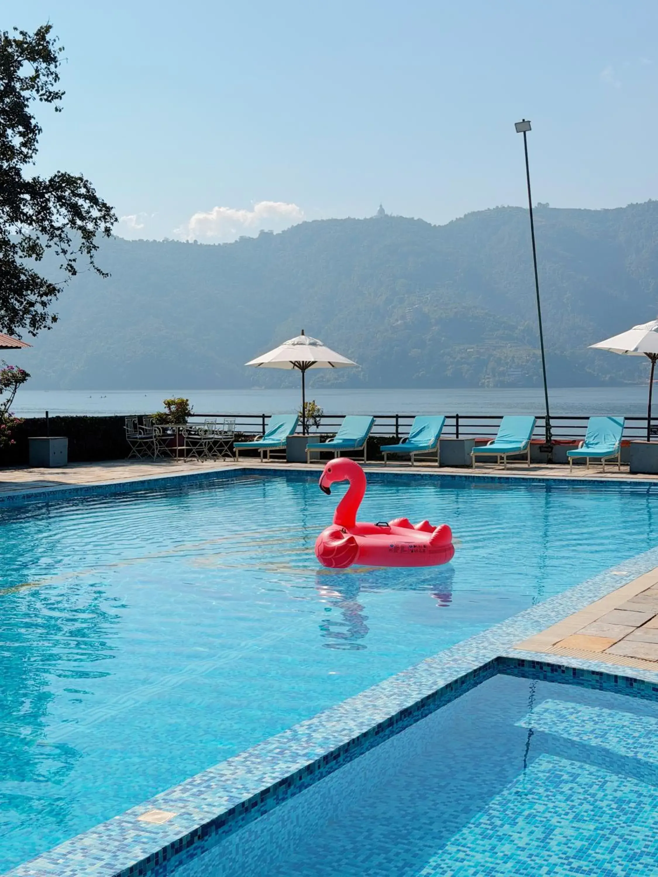 Swimming pool in Waterfront Resort by KGH Group Swimming pool in Waterfront Resort by KGH Group