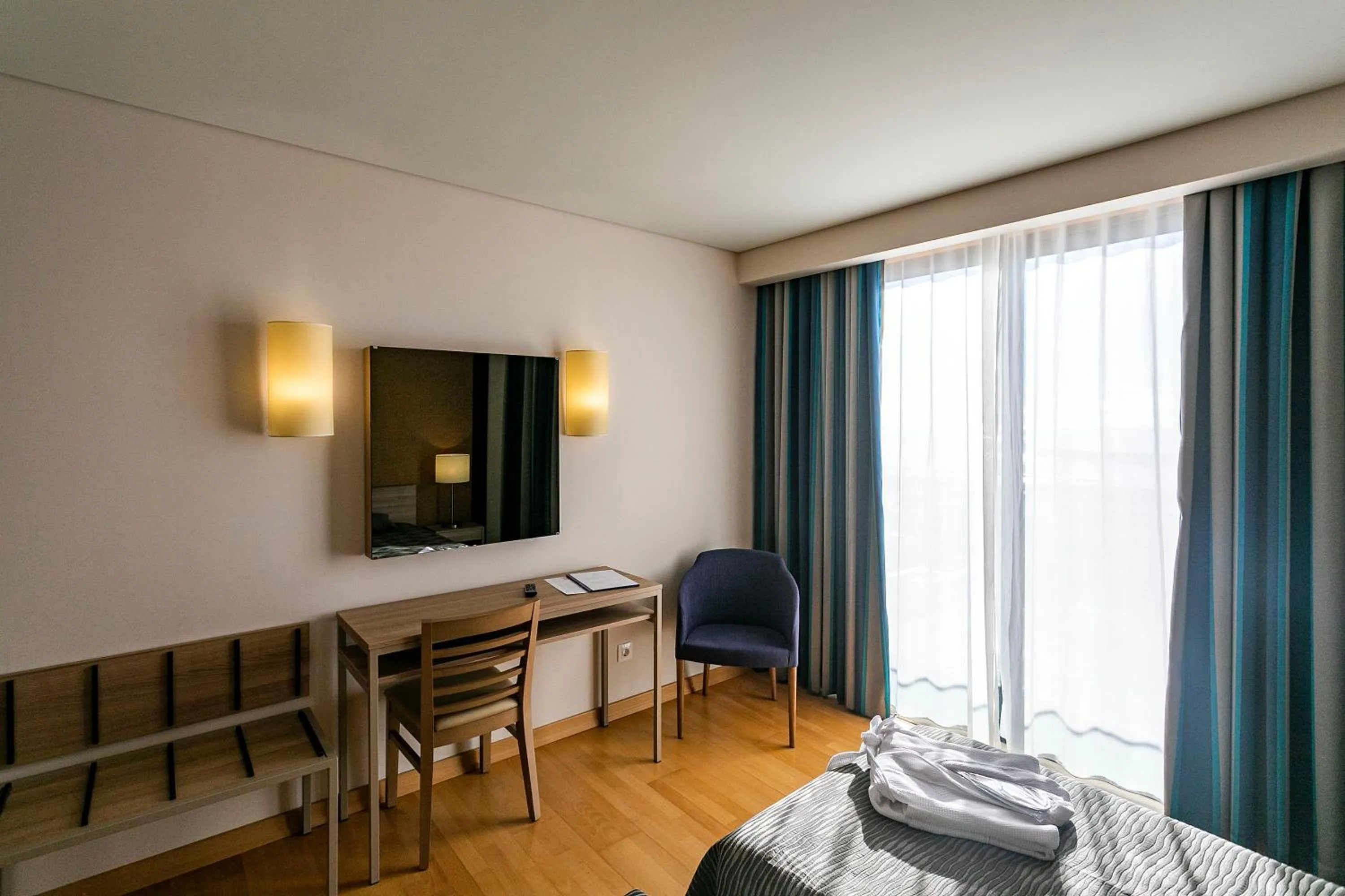 TV and multimedia, Bed in Antillia Hotel