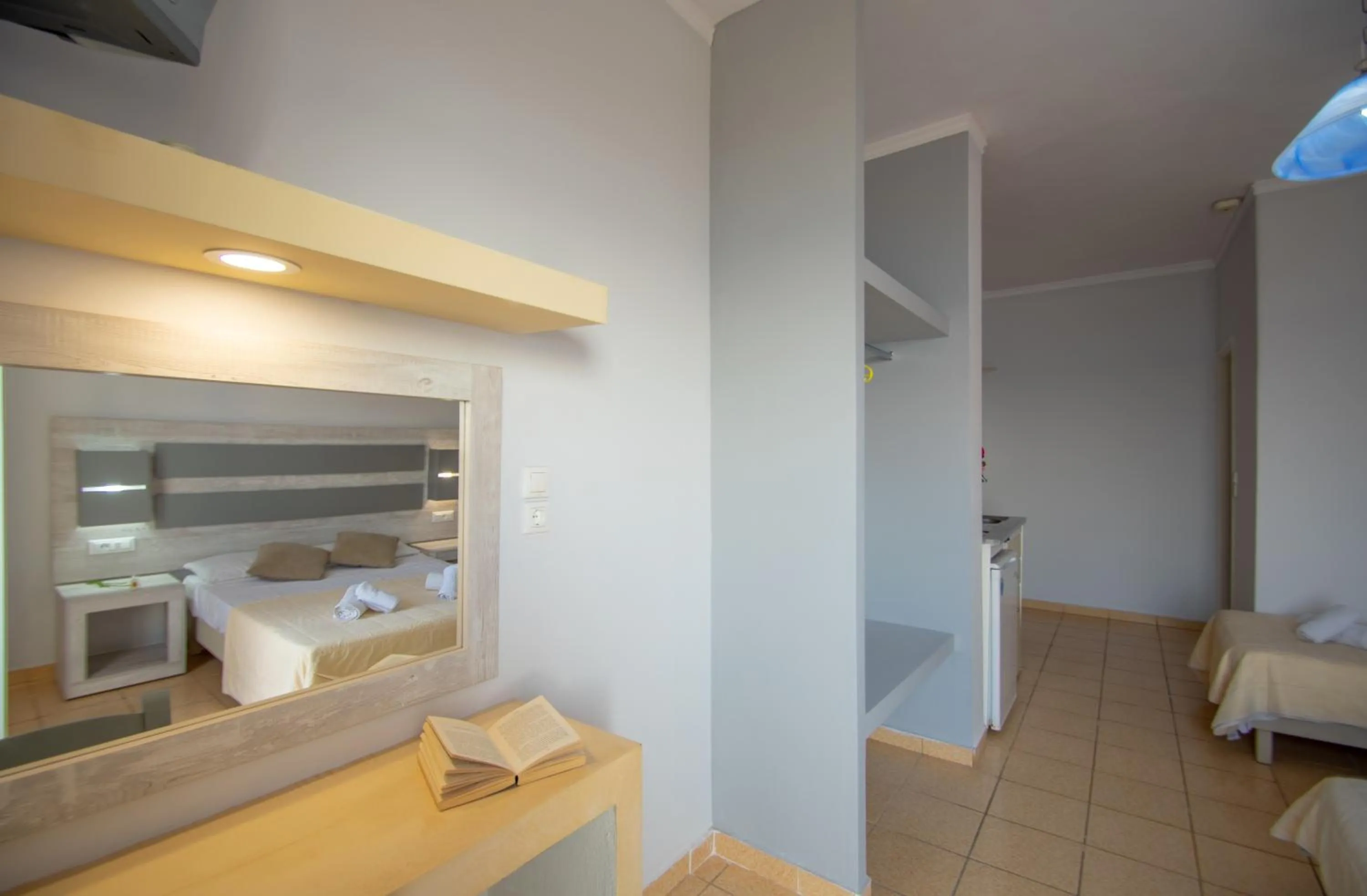 Kitchen or kitchenette, Bed in Agoulos Beach Hotel