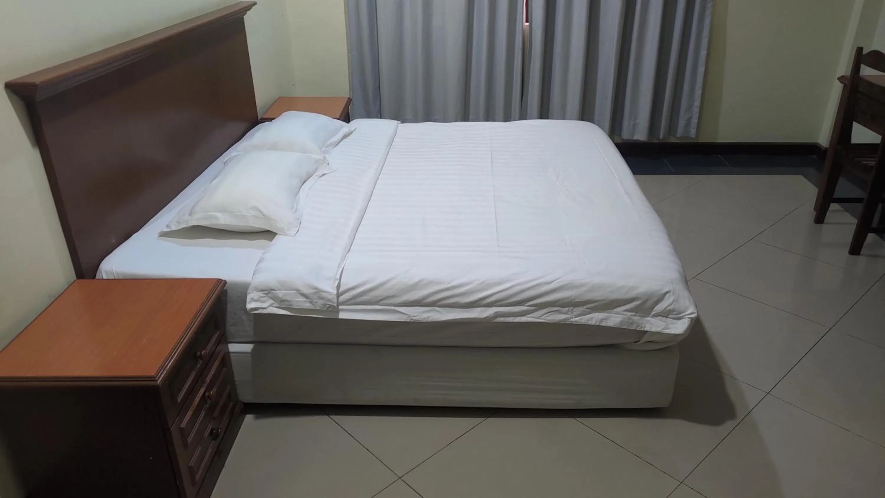 Bed in The Upper Deck Hotel