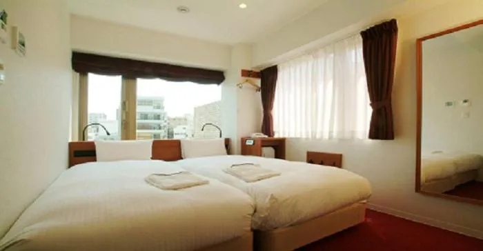 Bed in Benikea Calton Hotel Osaka Doutonbori