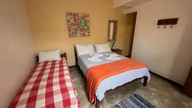 Photo of the whole room, Bed in Pousada Casa das Rosas