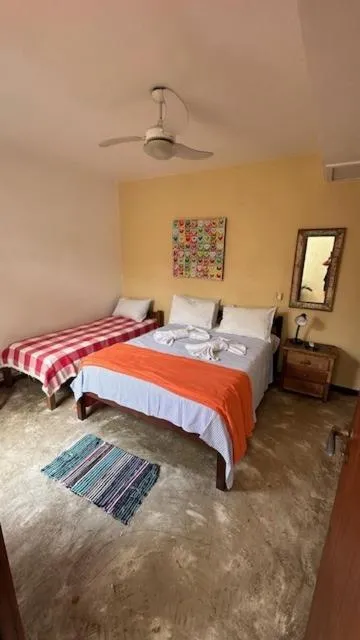 Photo of the whole room, Bed in Pousada Casa das Rosas