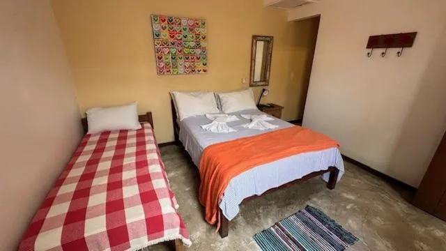 Photo of the whole room, Bed in Pousada Casa das Rosas