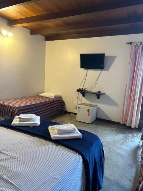 Photo of the whole room, Bed in Pousada Casa das Rosas