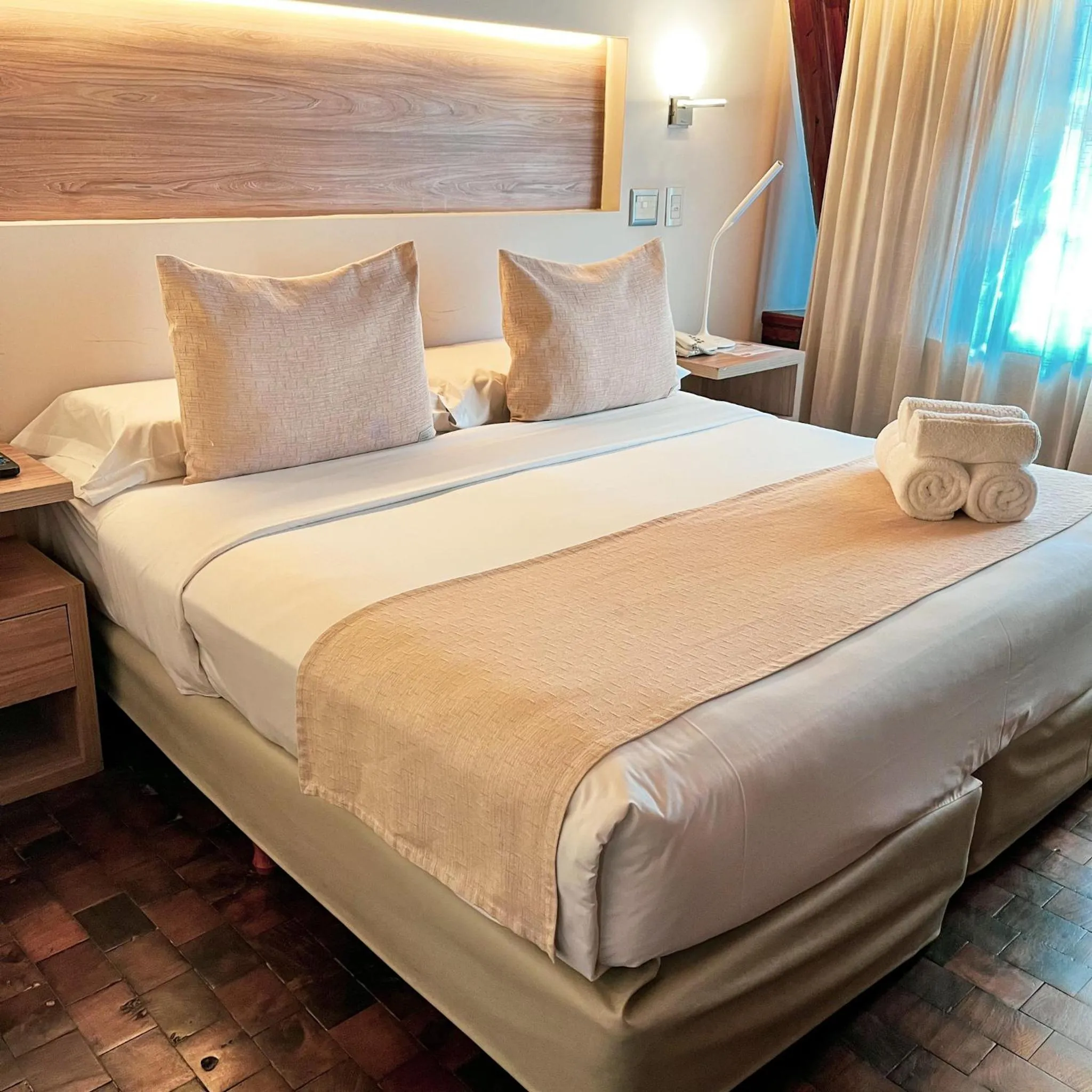 Bed in Portal del Lago Hotel